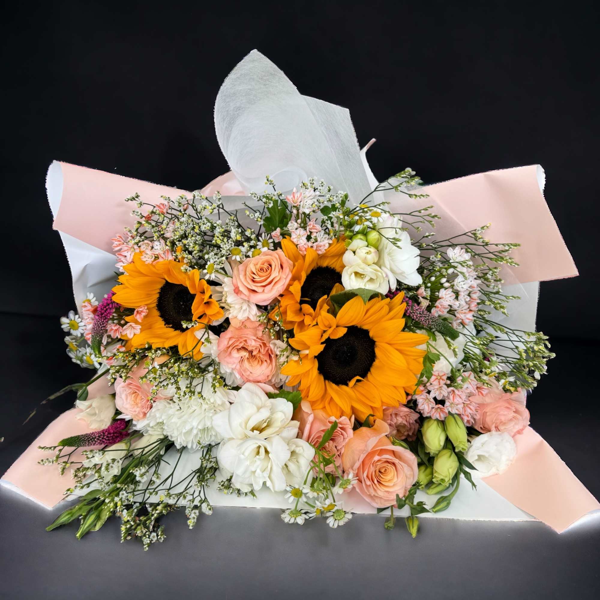 Get your other half a beautiful 7 pink roses and 1 sunflower Get your other half a beautiful 7 pink roses and 1 sunflower