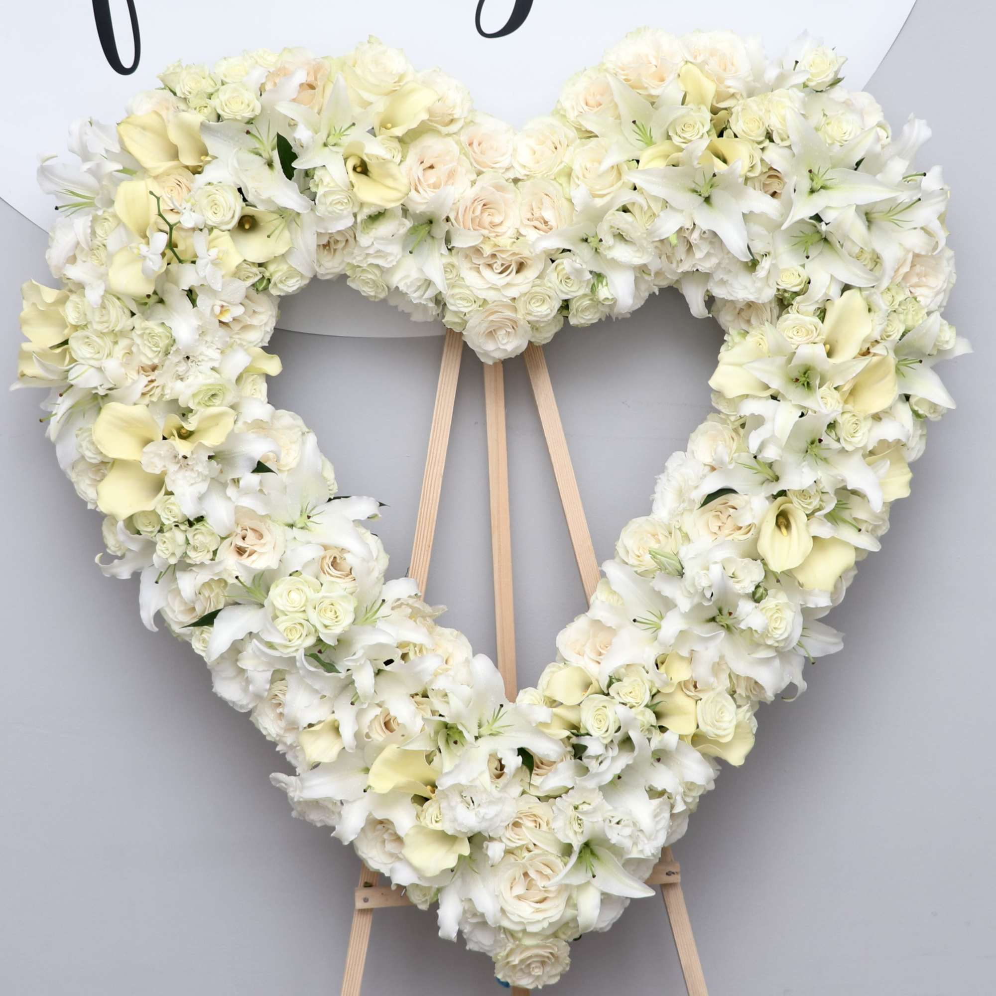 This heart wreath is made with all white florals including beautiful calla