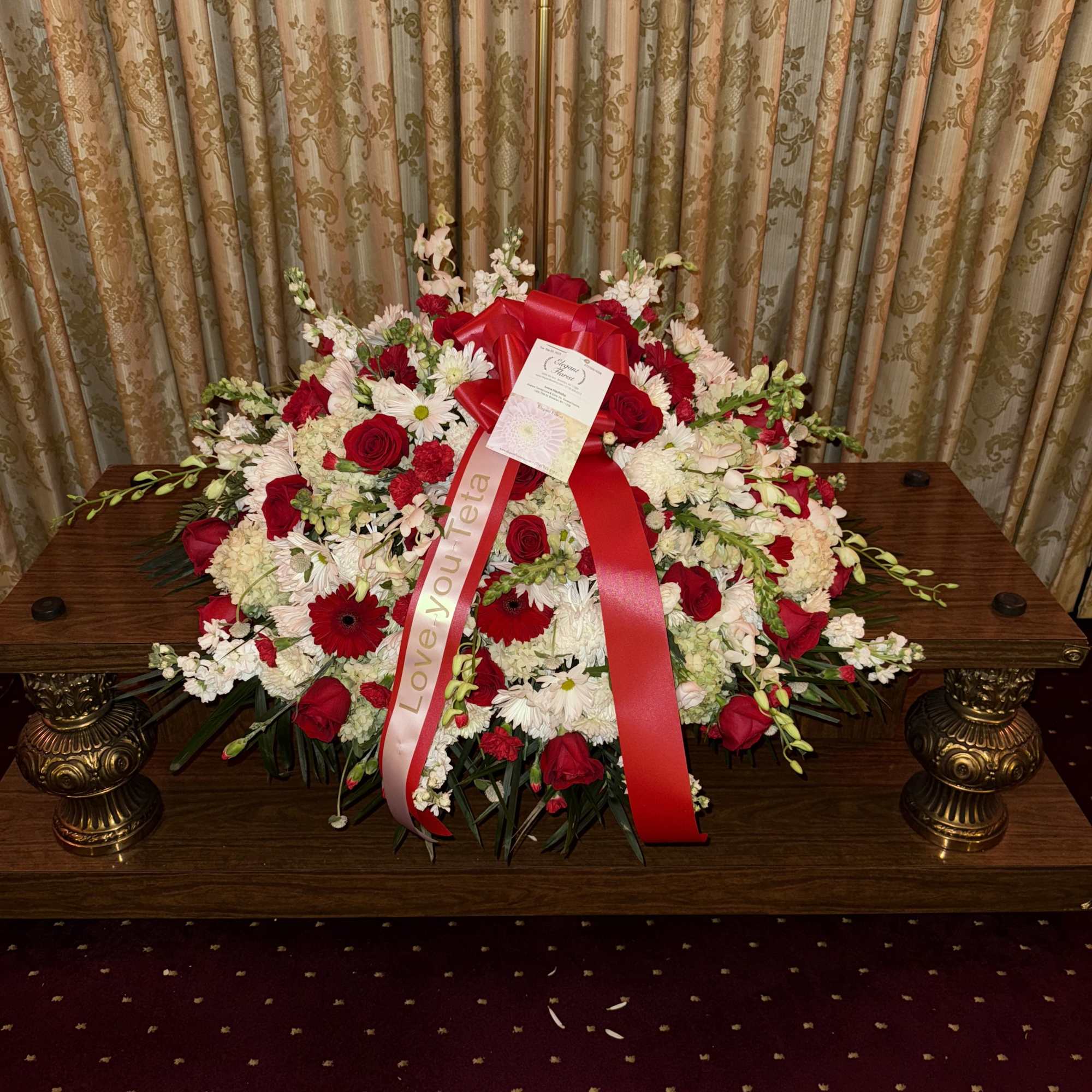 A graceful expression of love and remembrance, this casket spray combines the