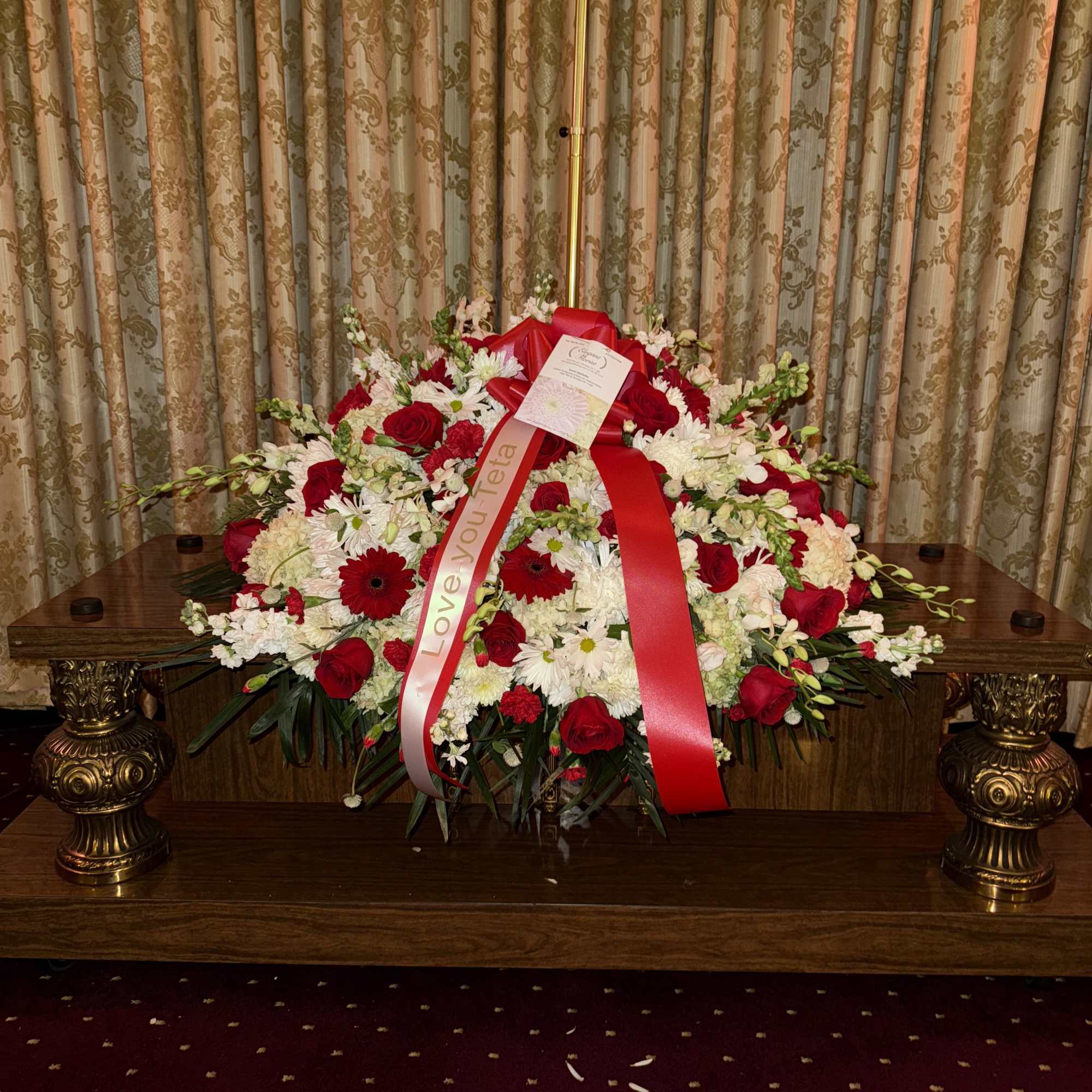 A graceful expression of love and remembrance, this casket spray combines the