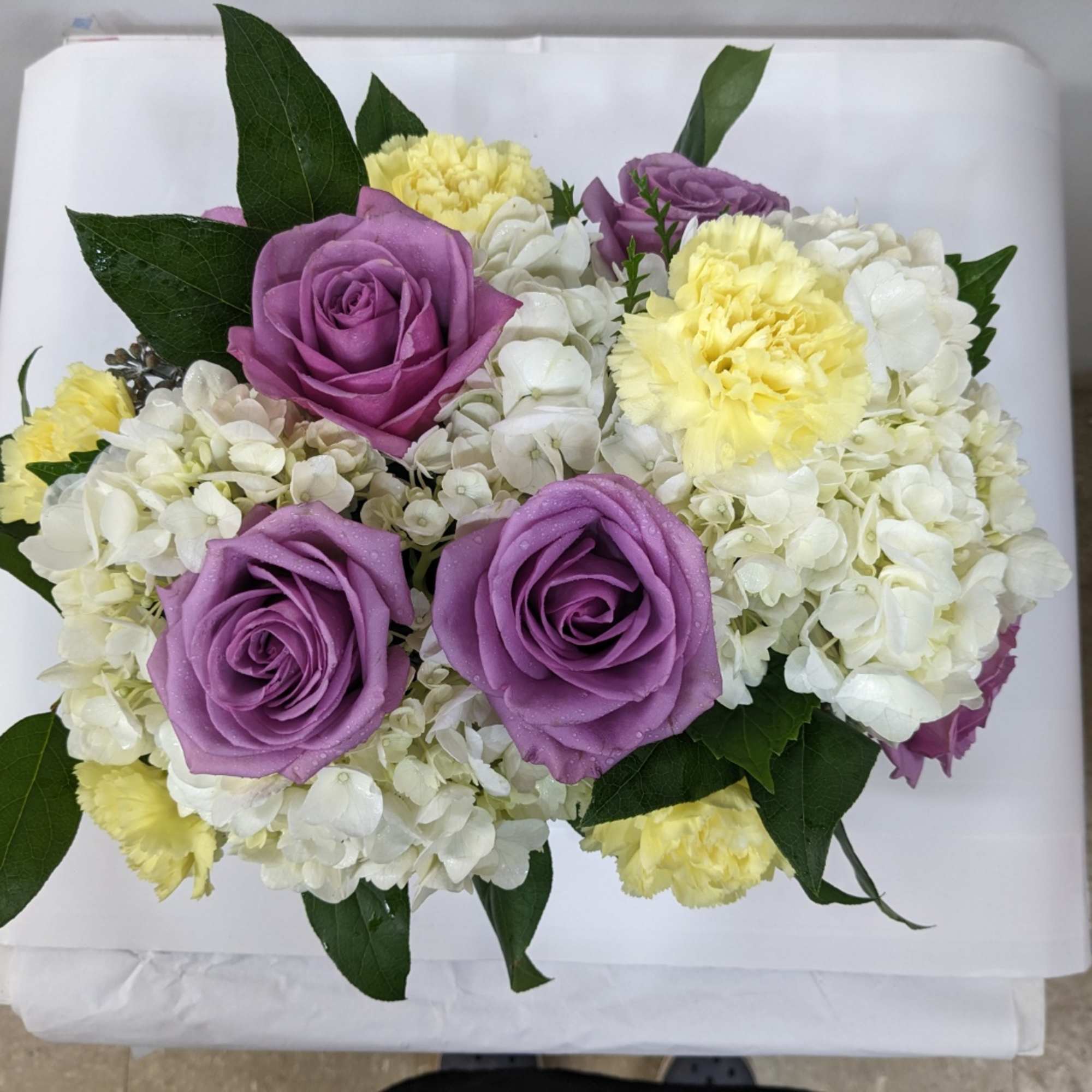 A pastel flowering basket brings peace to any space. Send this beautiful