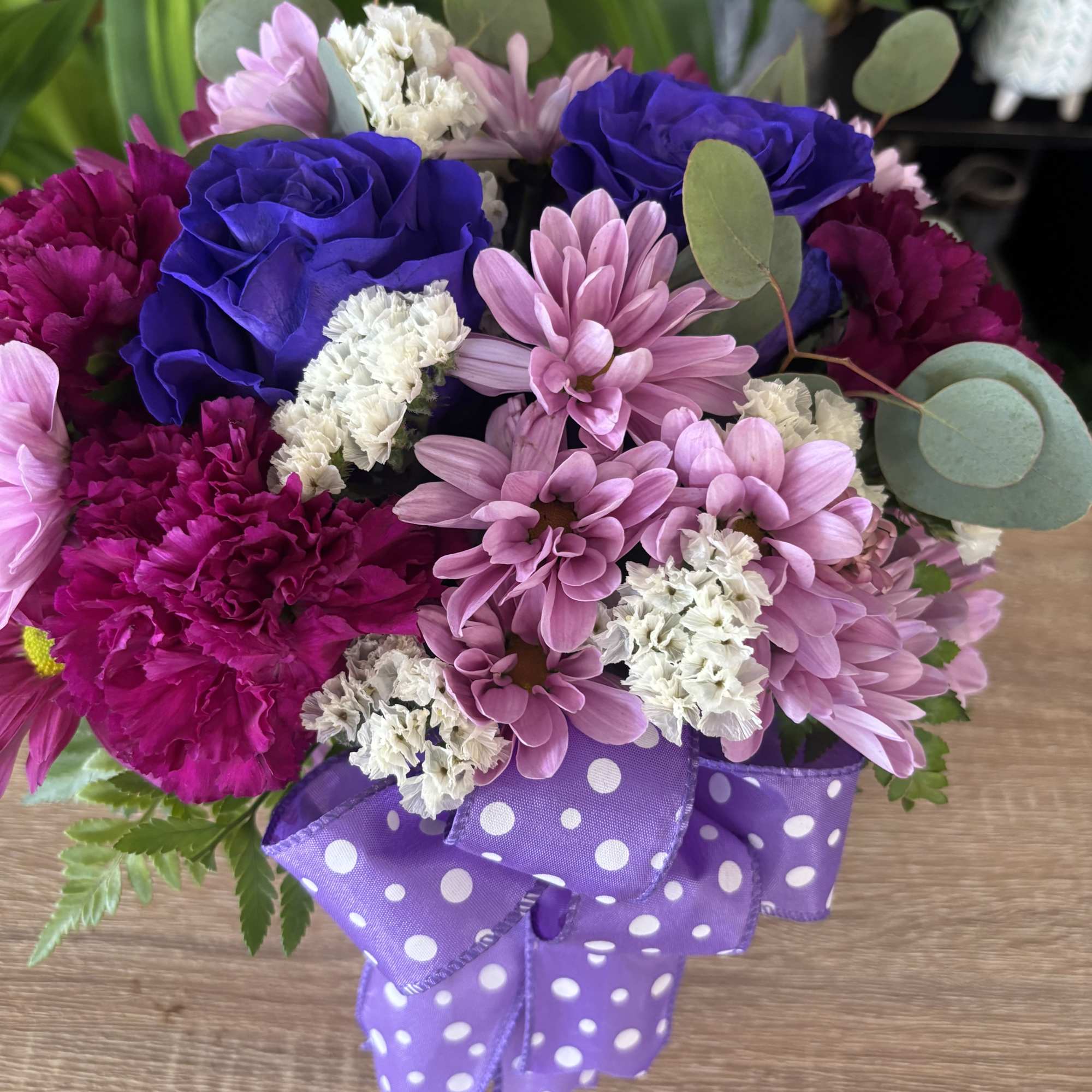 fresh flowers in polka dot vase 