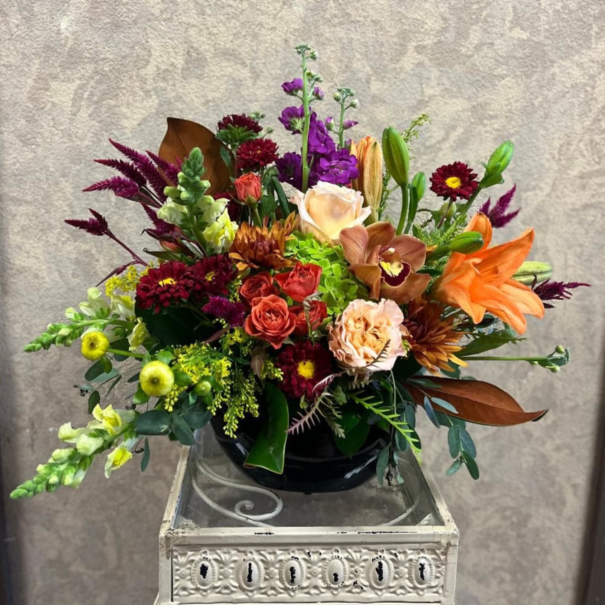 Type of Flowers: Purple Stock, Orange Spray Roses, Peachy Blush Roses, Yellow