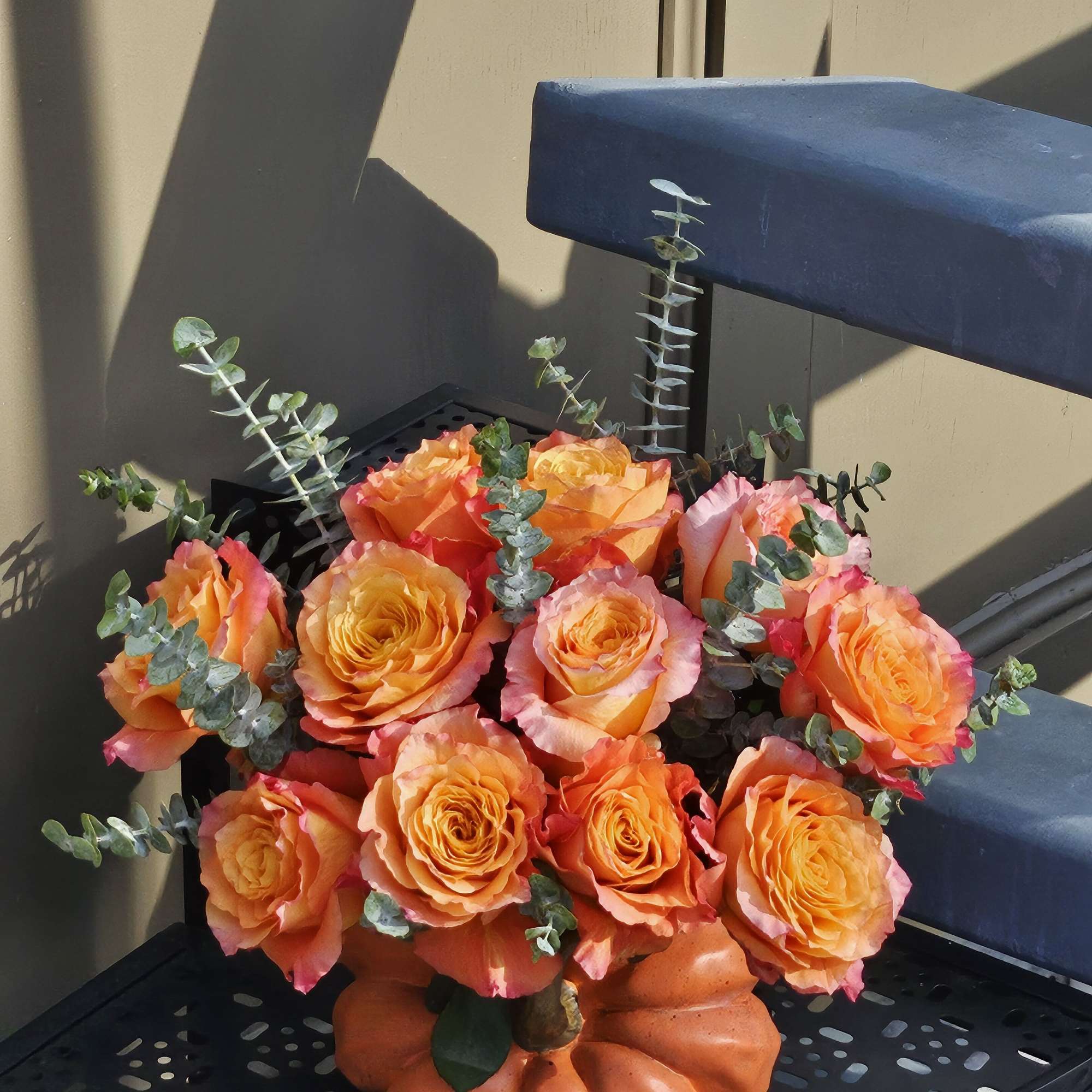 Chick roses -Free Spirit in a pumpkin vase. 