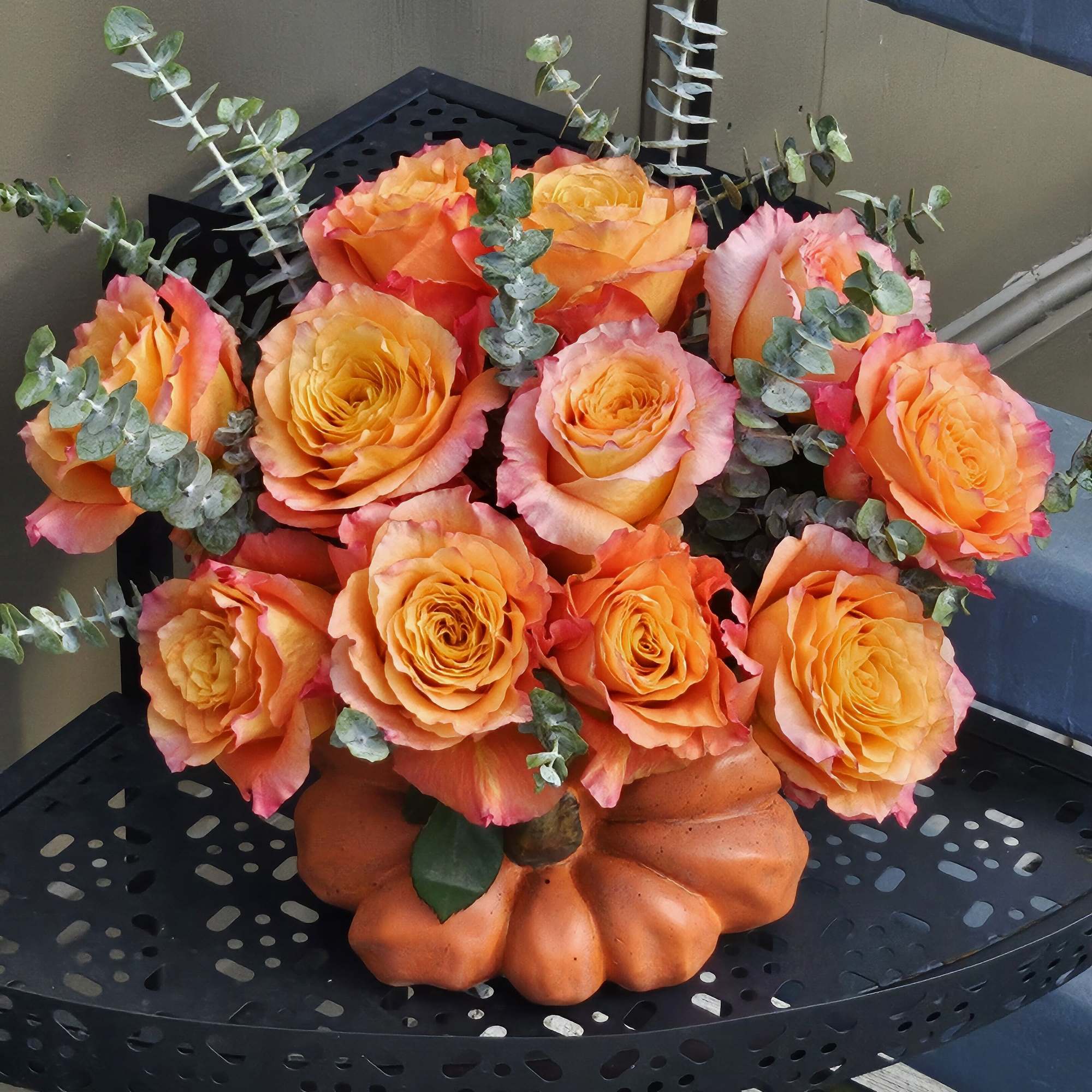Chick roses -Free Spirit in a pumpkin vase. 