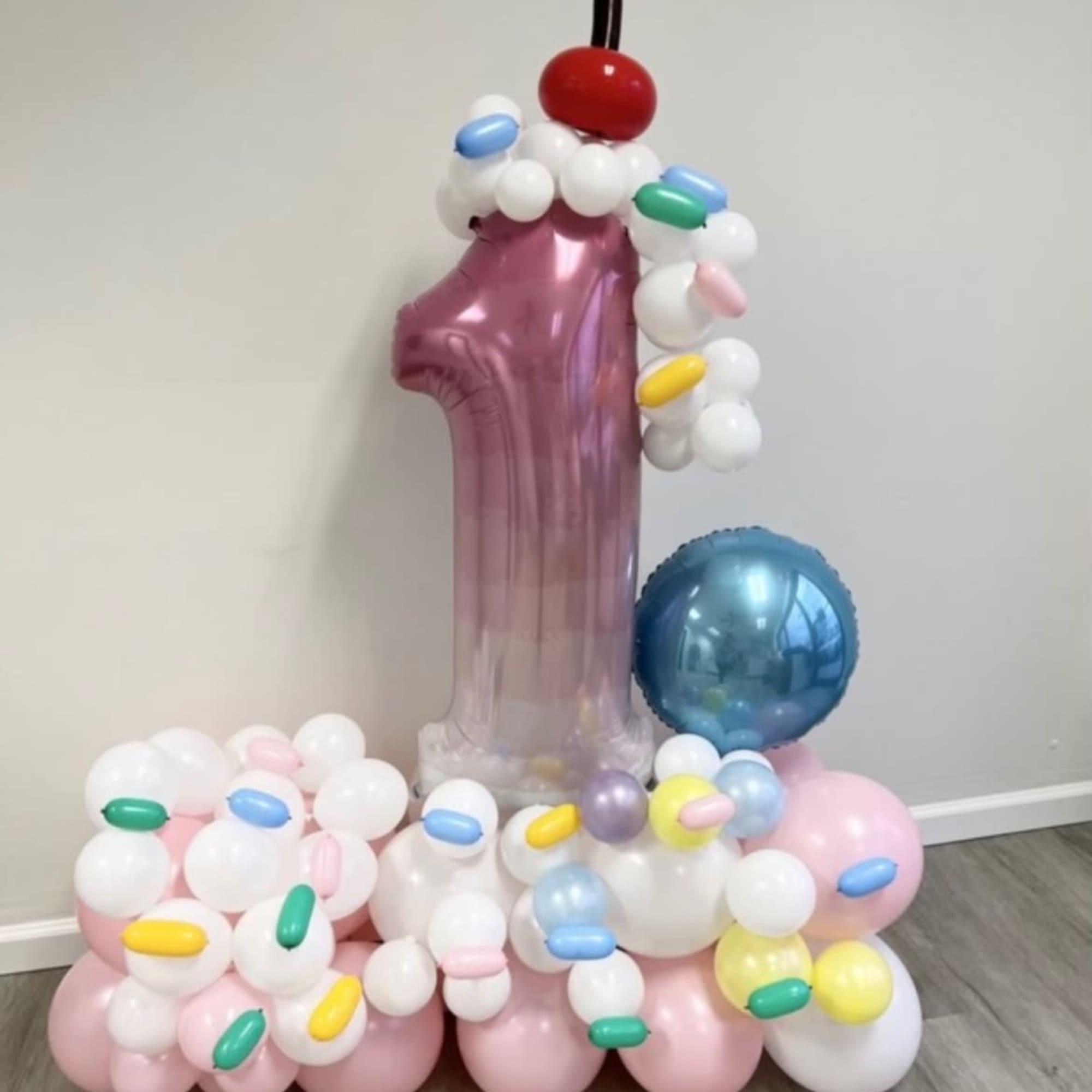 Our custom balloon arrangements featuring a single large number are perfect for