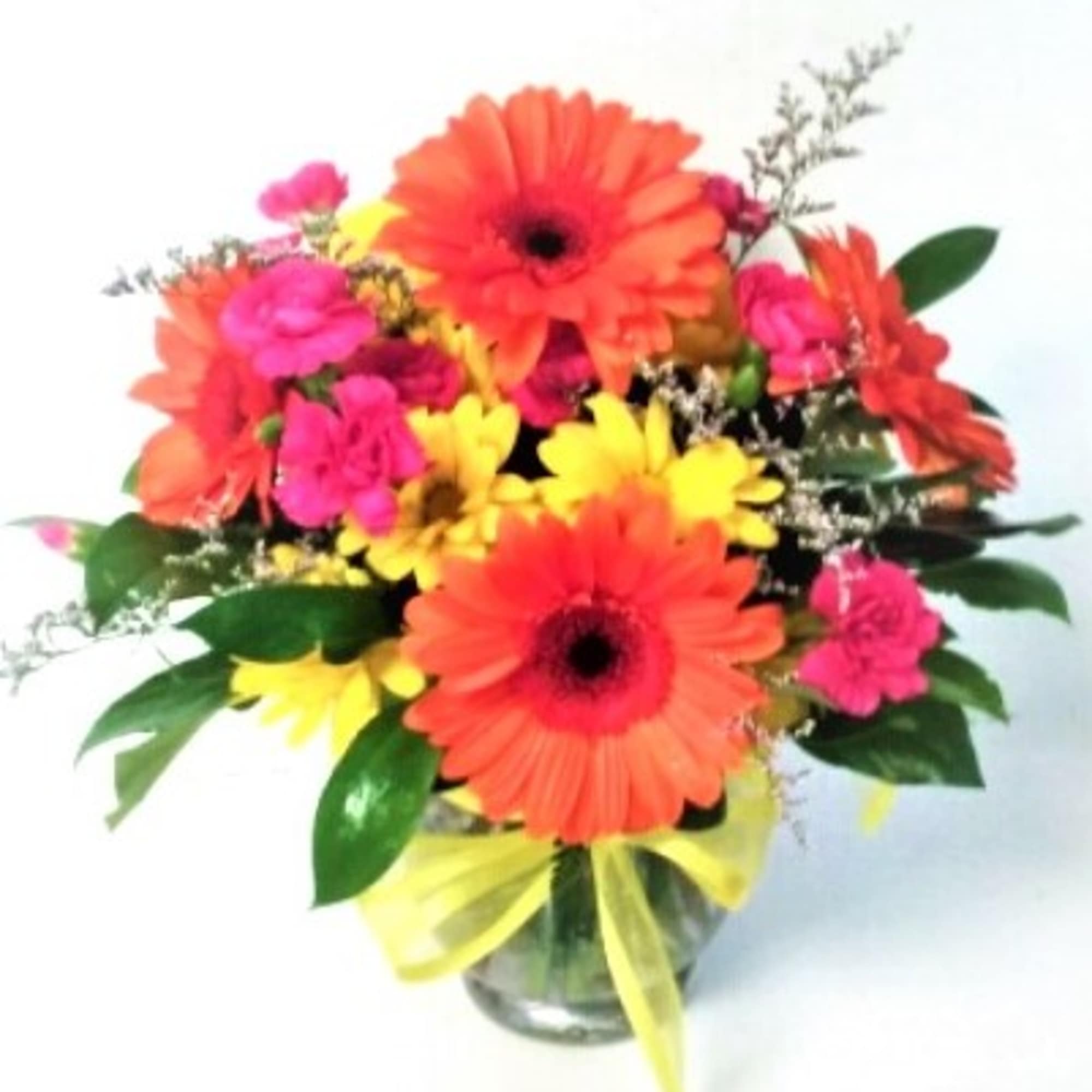 Earthy and cheerful clear vase of Sunflowers,gerbera daisies,alstromeria and mixed fillers,adorned with
