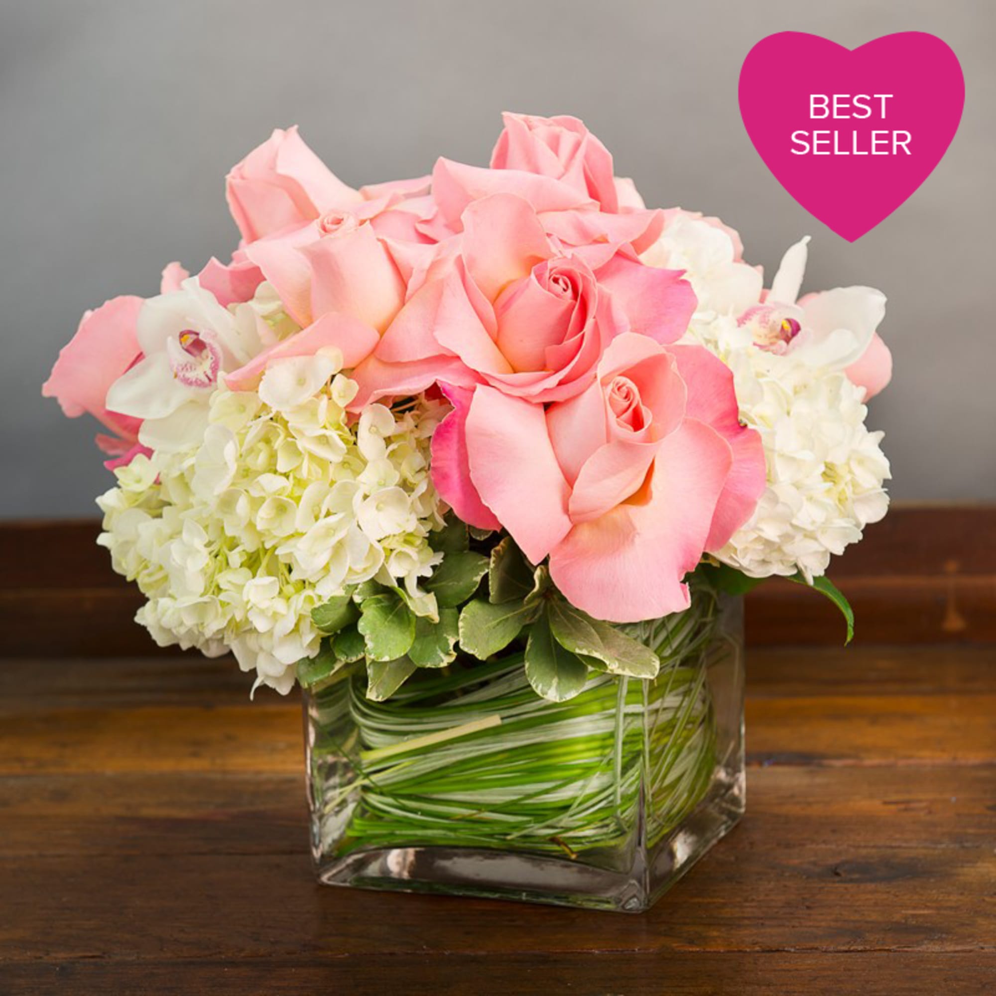WHITE HYDRANGEA AND PINK ROSES WITH CYMBIDIUM ORCHIDS
IN A SQUARE GLASS VASE
