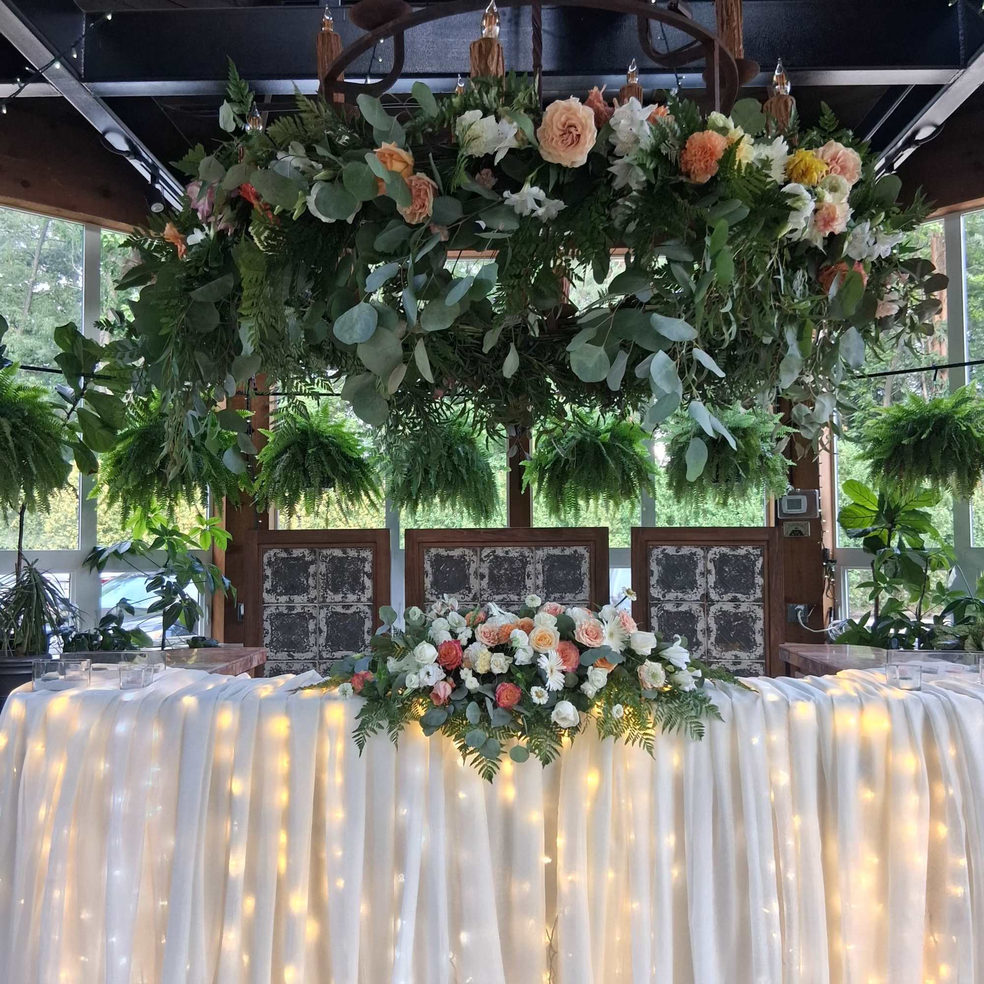 Floral garland around chandelier 