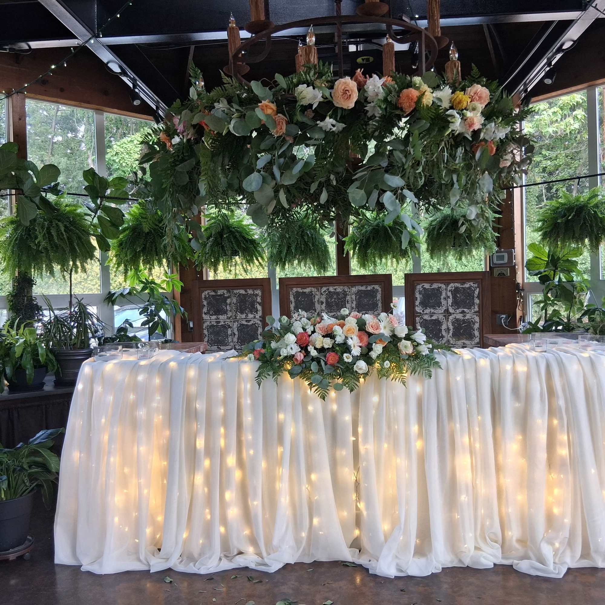 Floral garland around chandelier 