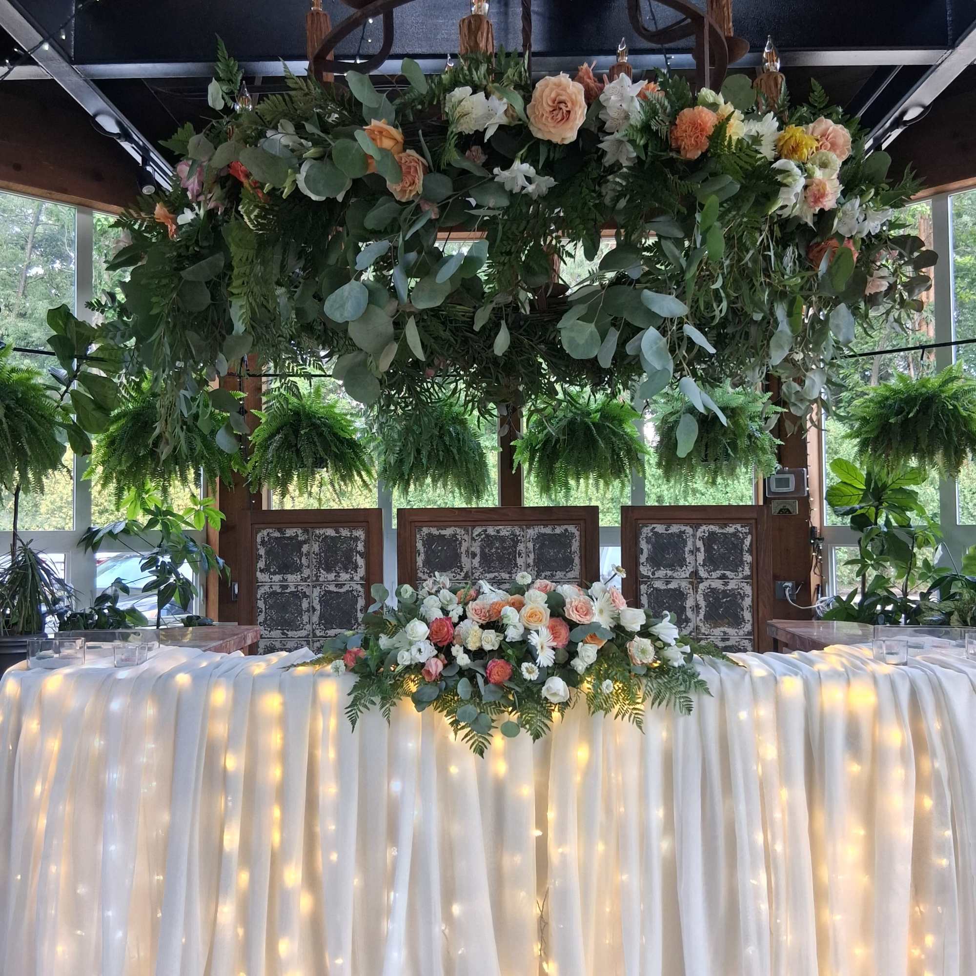 Floral garland around chandelier 