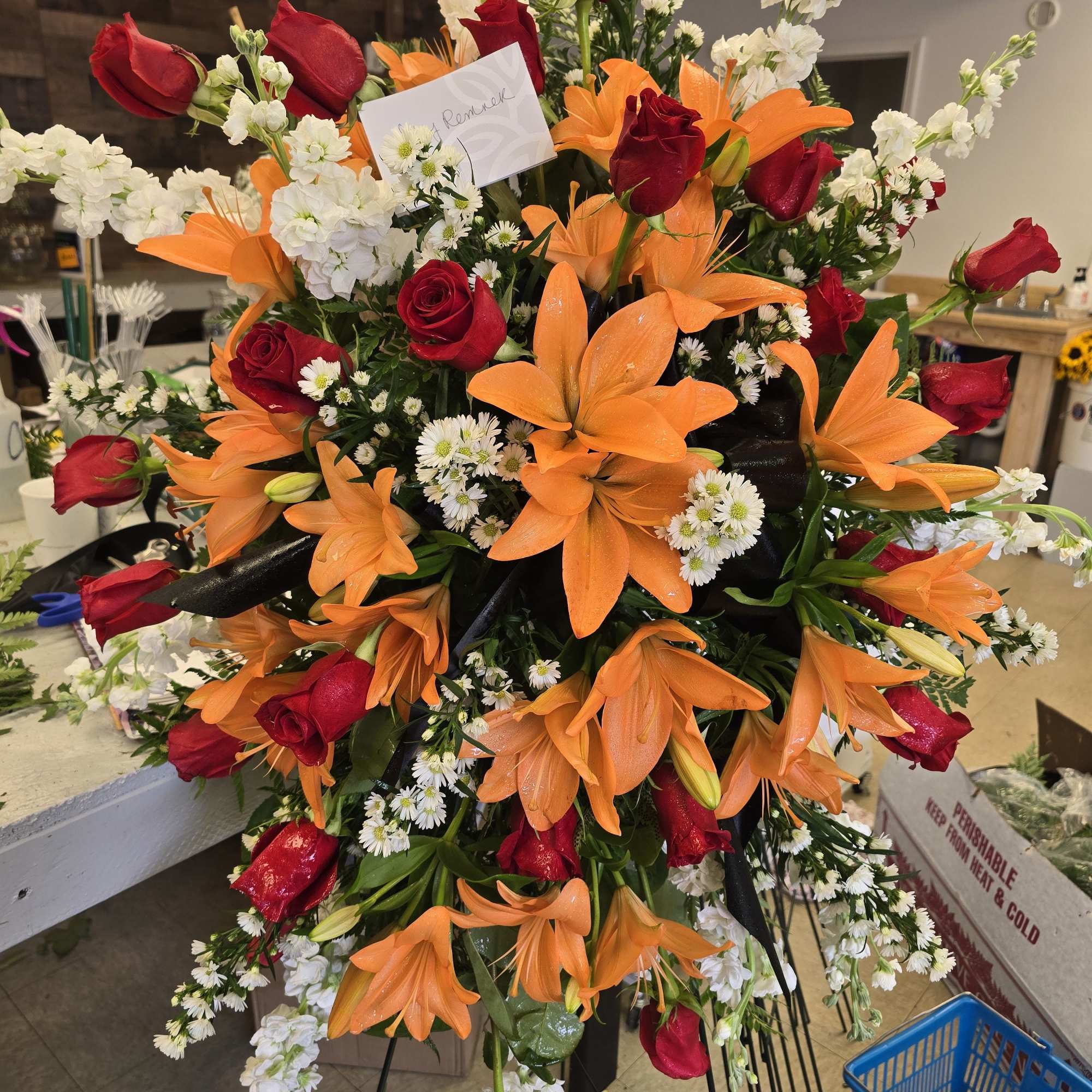 This majestic standing spray, expertly crafted by Willoughby Florist, offers a heartfelt This majestic standing spray, expertly crafted by Willoughby Florist, offers a heartfelt