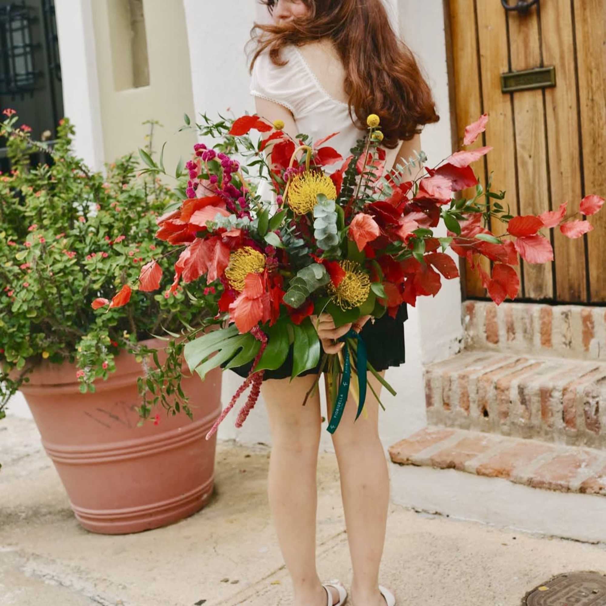 Relish those fleeting warm months with this vibrant seasonal display expertly arranged