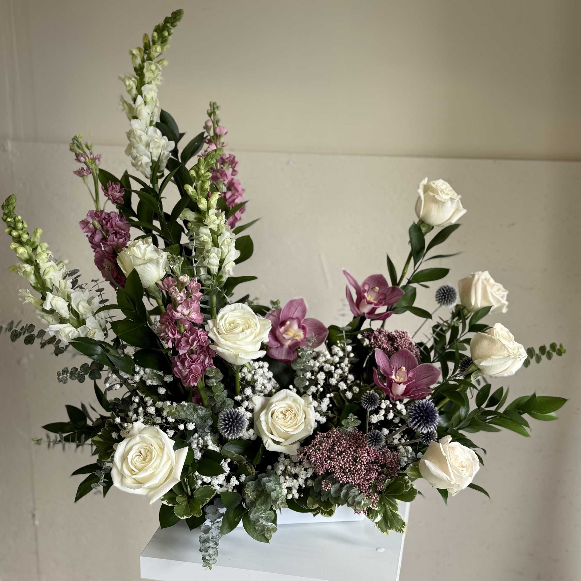 A delicate design featuring pink-toned orchids, symbolizing love, grace, and timeless elegance. A delicate design featuring pink-toned orchids, symbolizing love, grace, and timeless elegance.