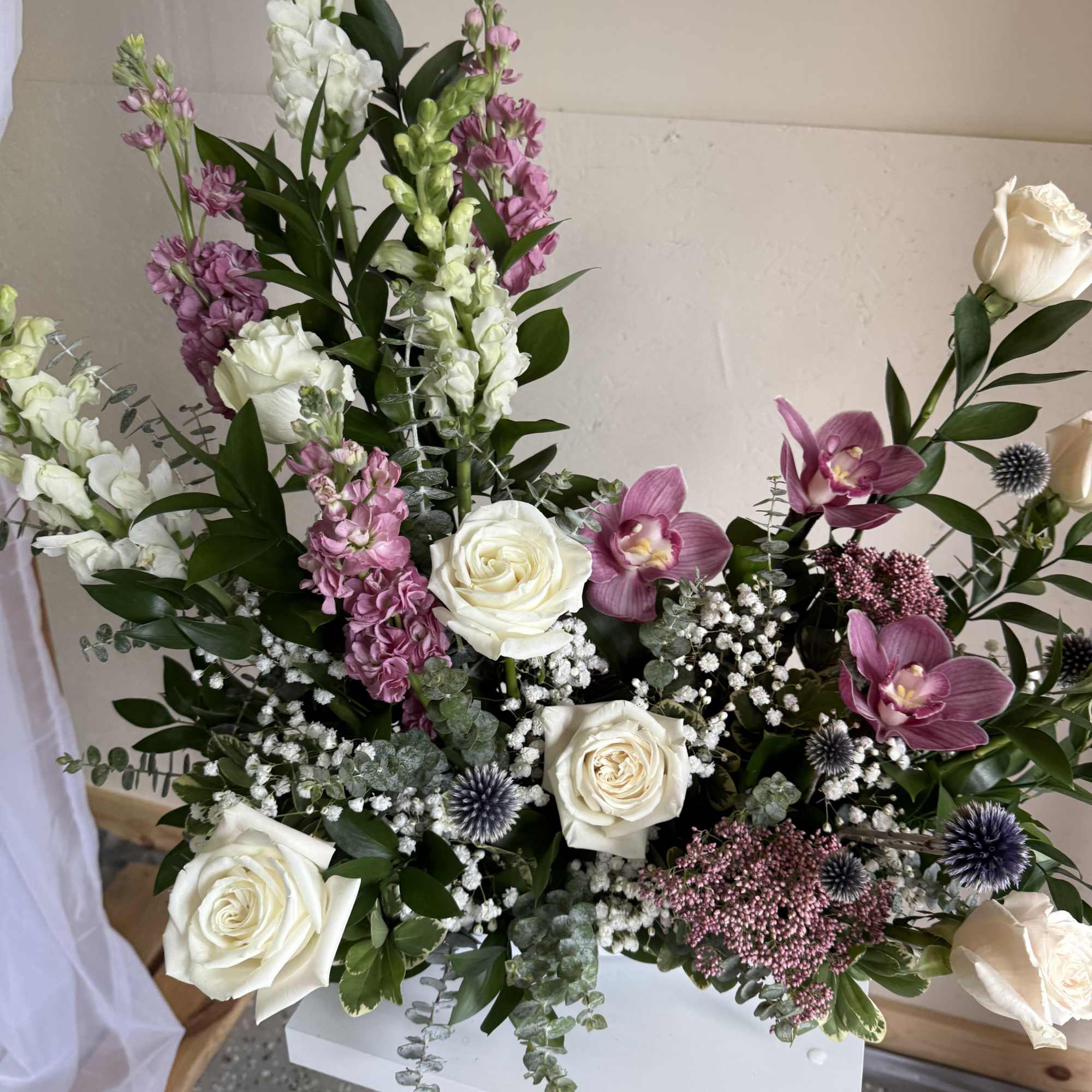 A delicate design featuring pink-toned orchids, symbolizing love, grace, and timeless elegance. A delicate design featuring pink-toned orchids, symbolizing love, grace, and timeless elegance.