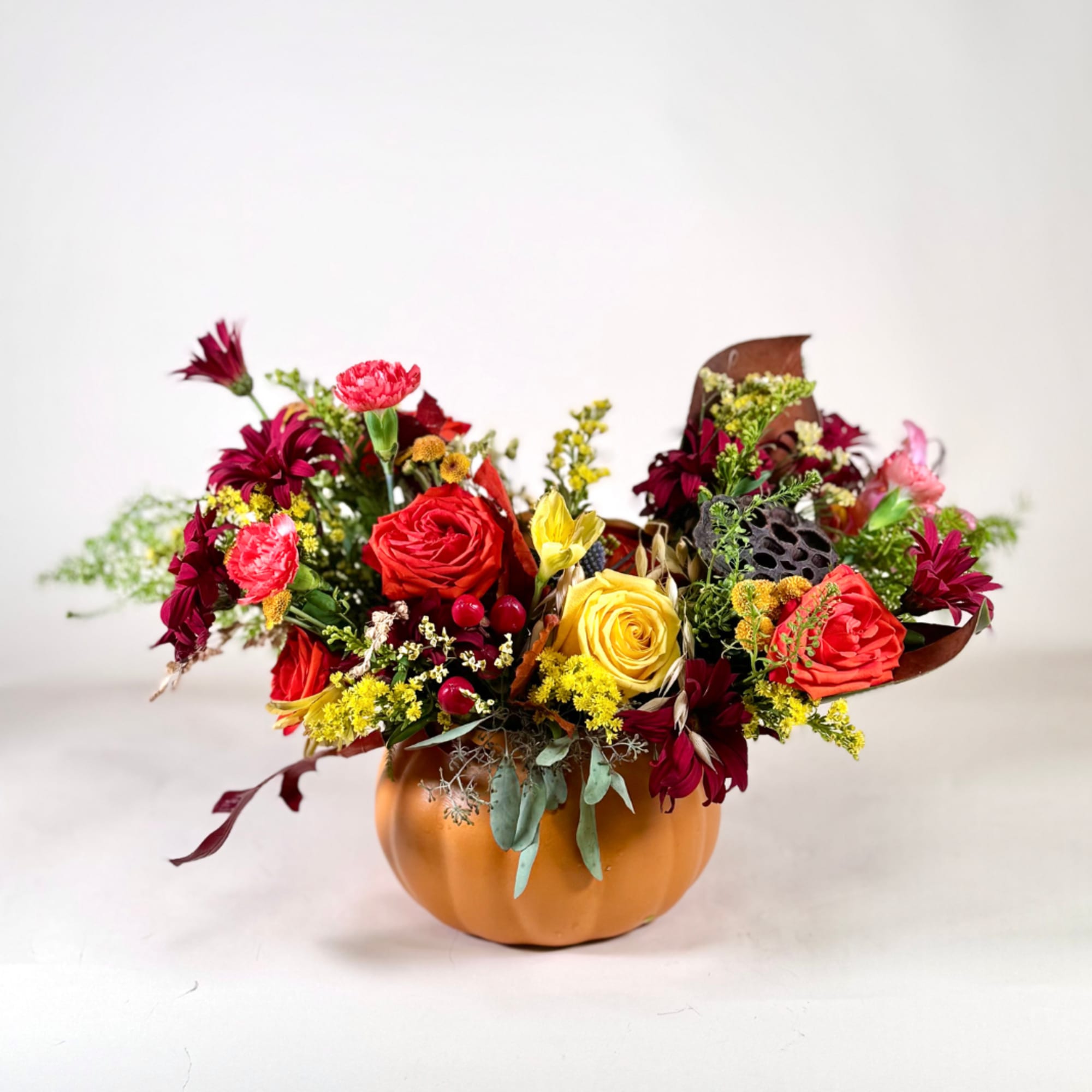 Our Pumpkin Spice Arrangement brings the warm colors of fall to life Our Pumpkin Spice Arrangement brings the warm colors of fall to life