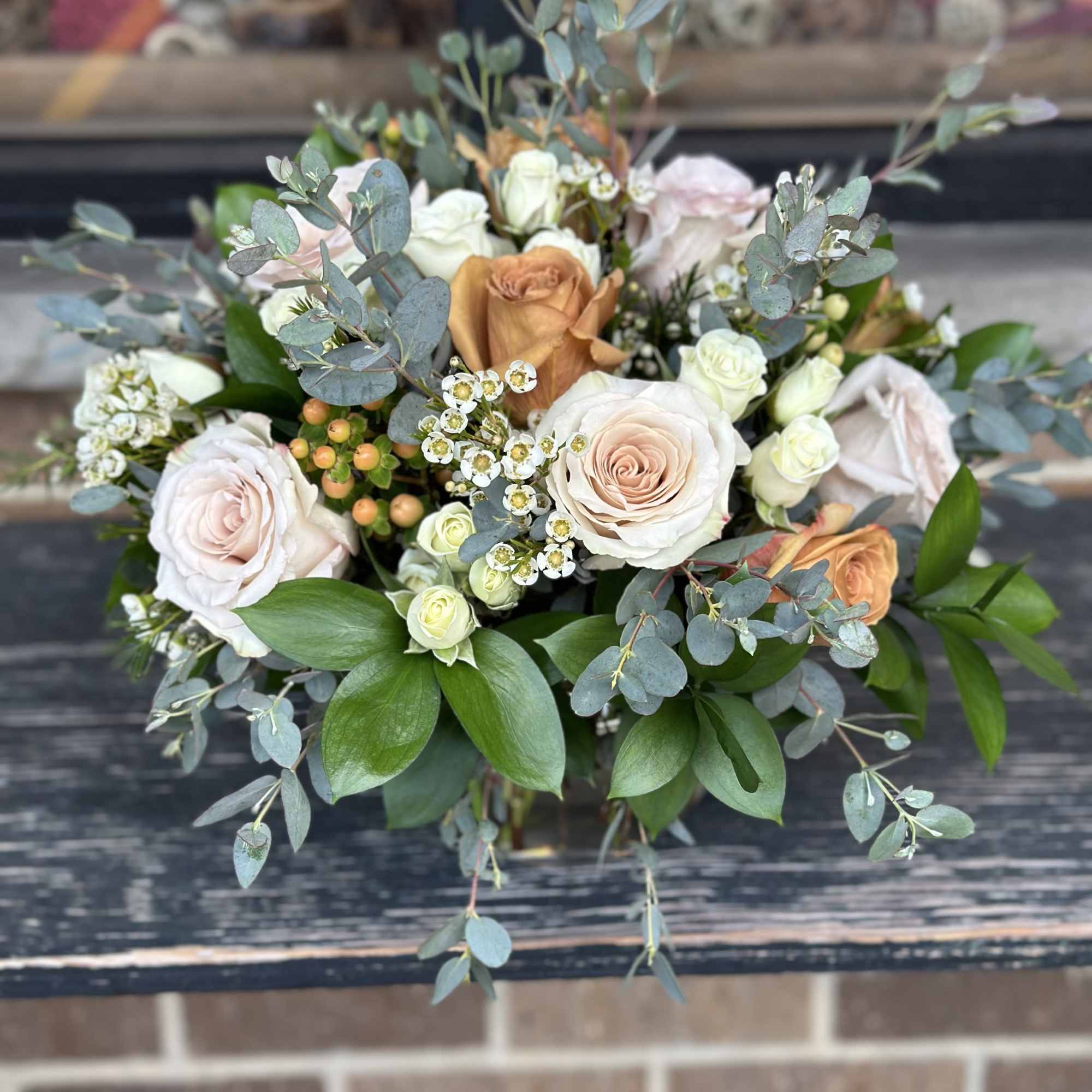 Celebrate the season with this warm and inviting centerpiece. Crafted with coffee