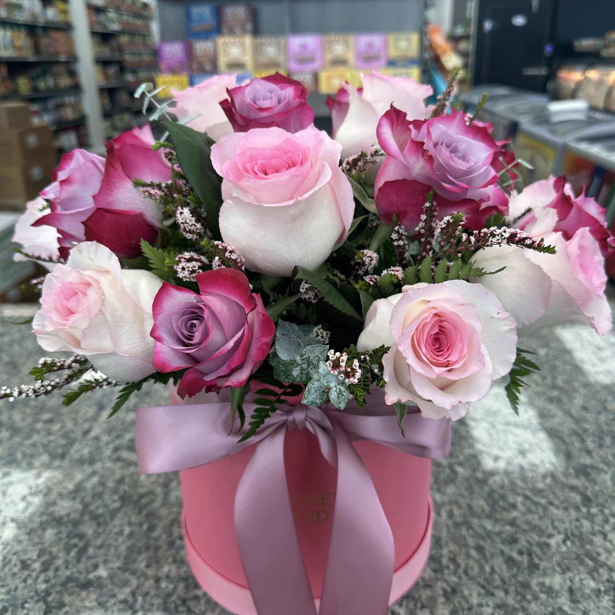 A perfect blend of roses and greenery, arranged in our signature custom