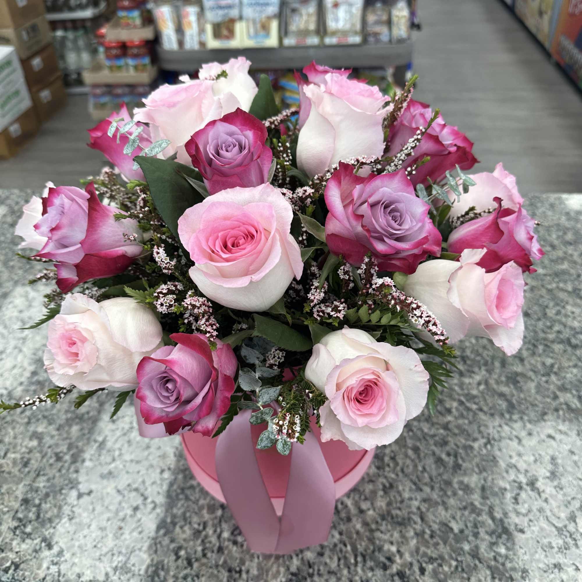 A perfect blend of roses and greenery, arranged in our signature custom