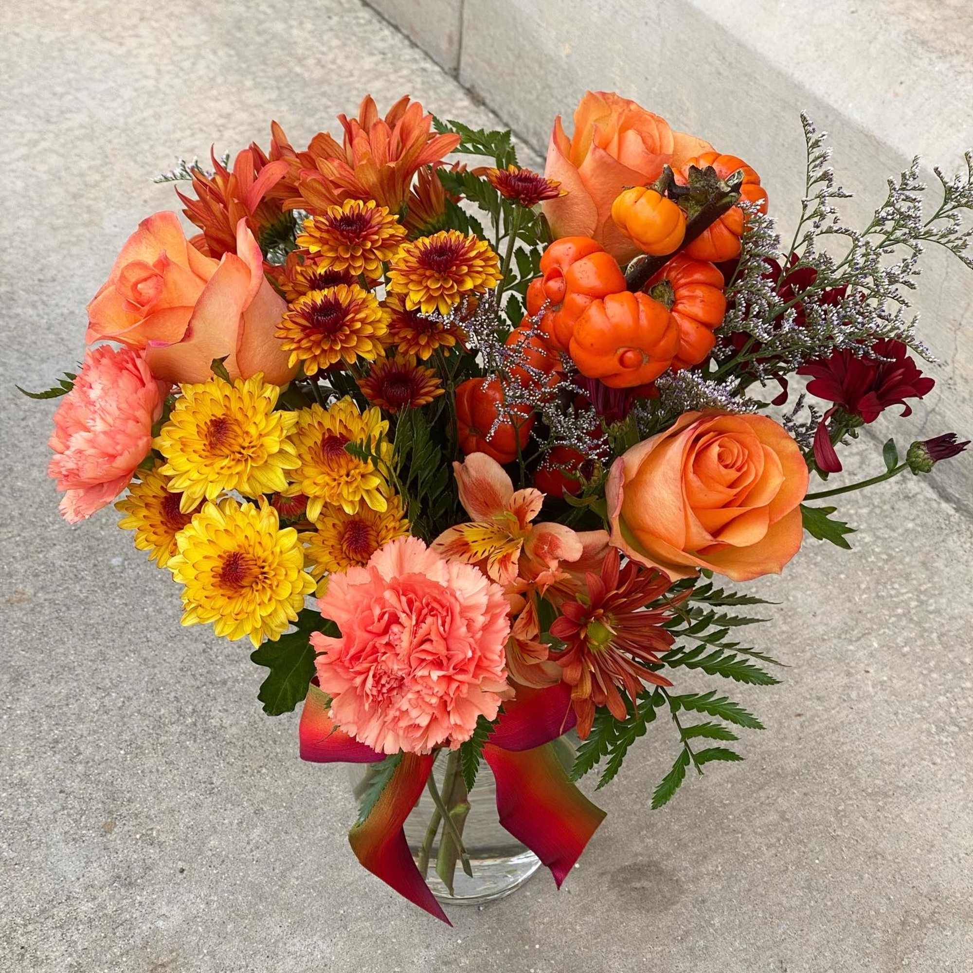 This is a mixed of chrysanthemum, daisy, asltromerias, roses, carnation, and mini