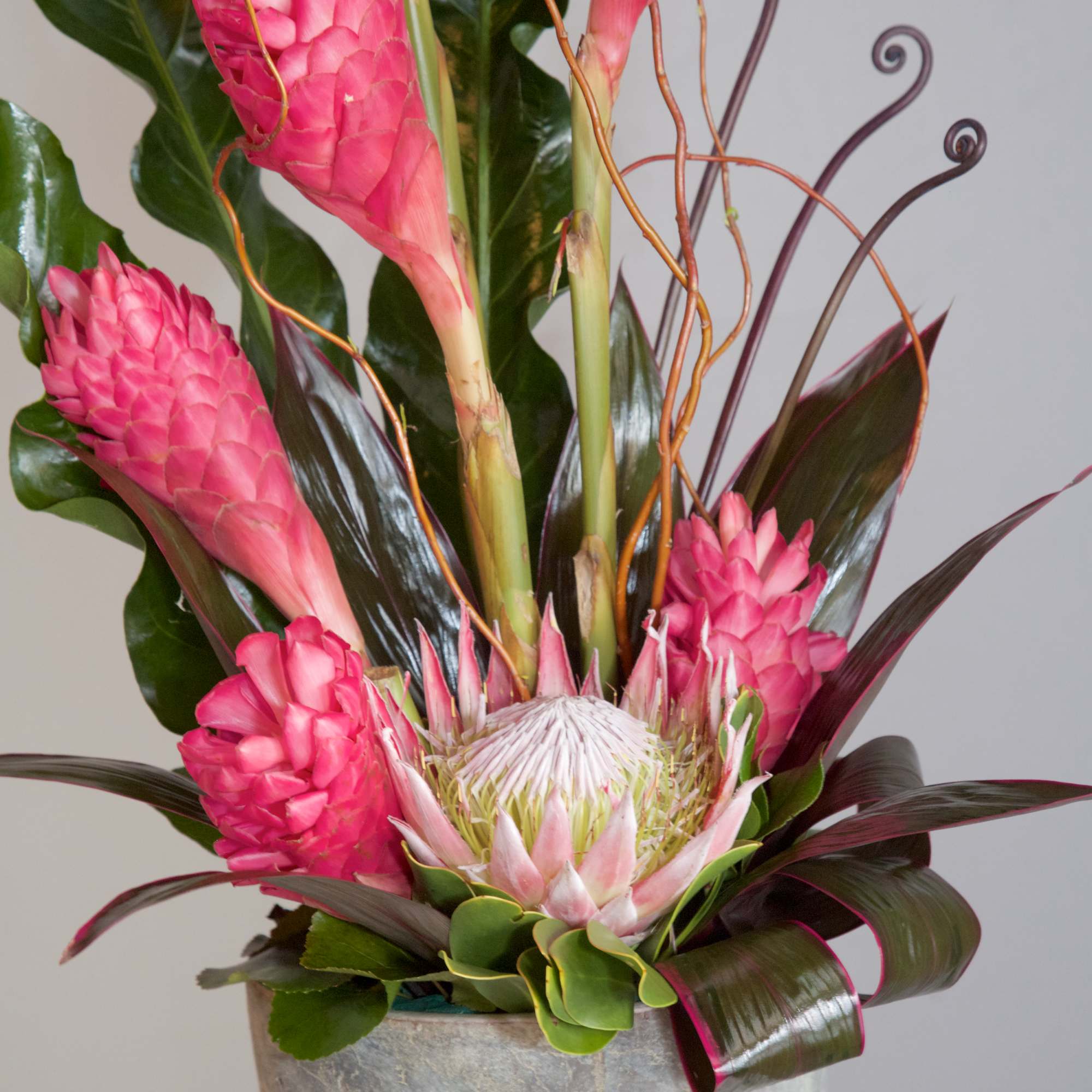 Show your love and devotion with this contemporary tropical arrangement of pink