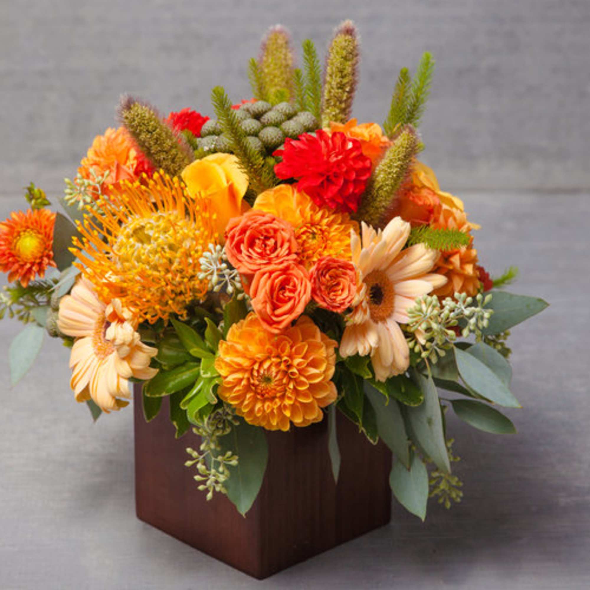 This eye-popping arrangement of dusk lit peaches, oranges, yellows and greens delivers