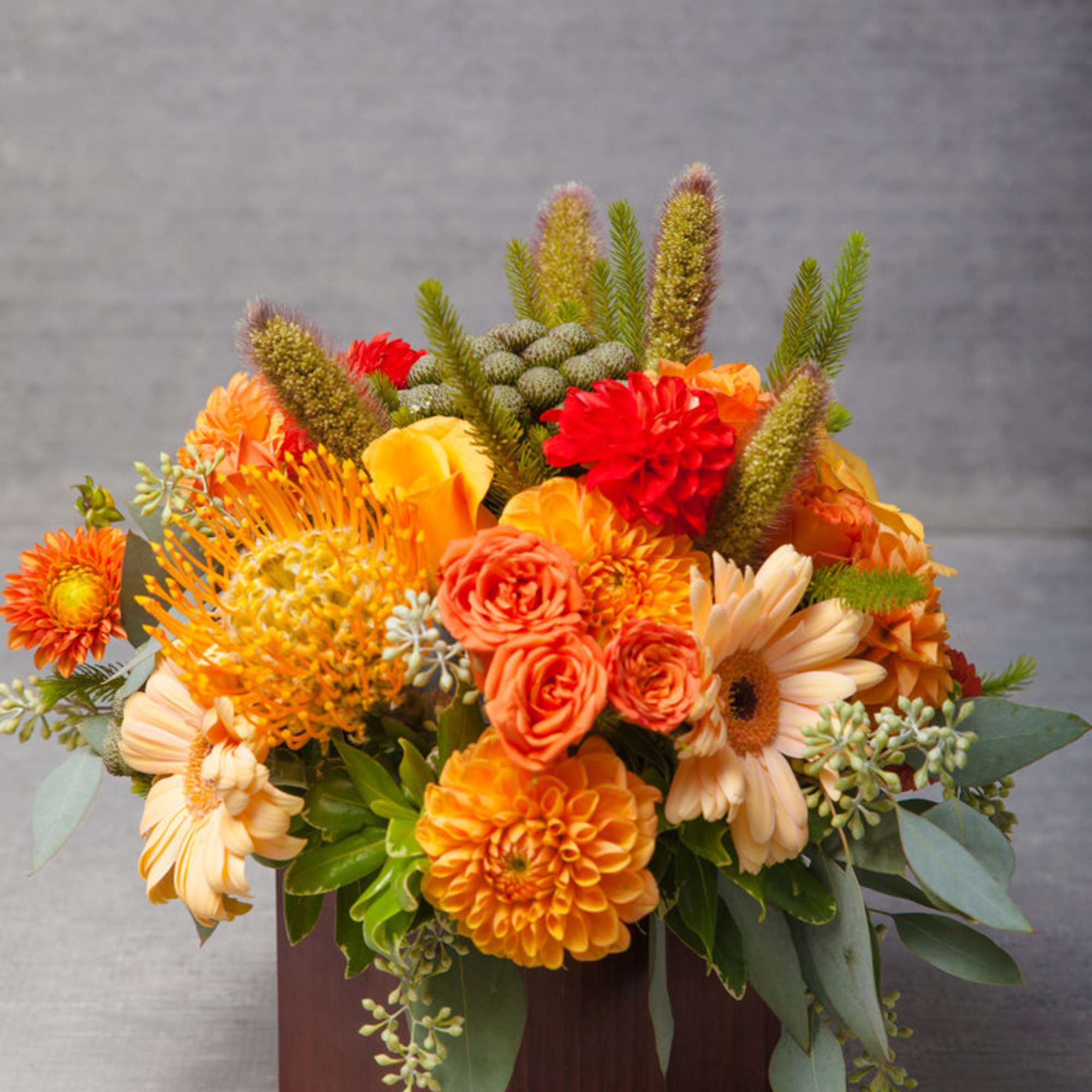 This eye-popping arrangement of dusk lit peaches, oranges, yellows and greens delivers