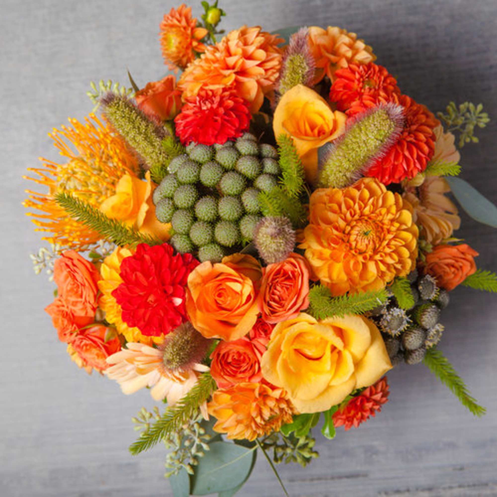 This eye-popping arrangement of dusk lit peaches, oranges, yellows and greens delivers