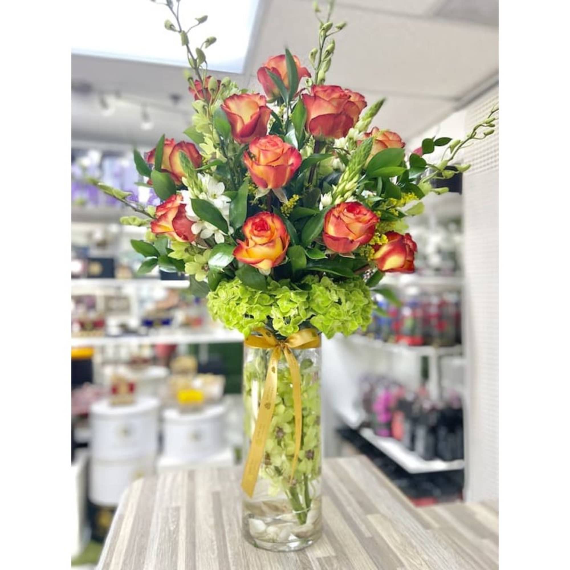 Underwater Orchids Arrangement: Unique arrangement of roses, lilies, greens, hydrangeas, and orchids