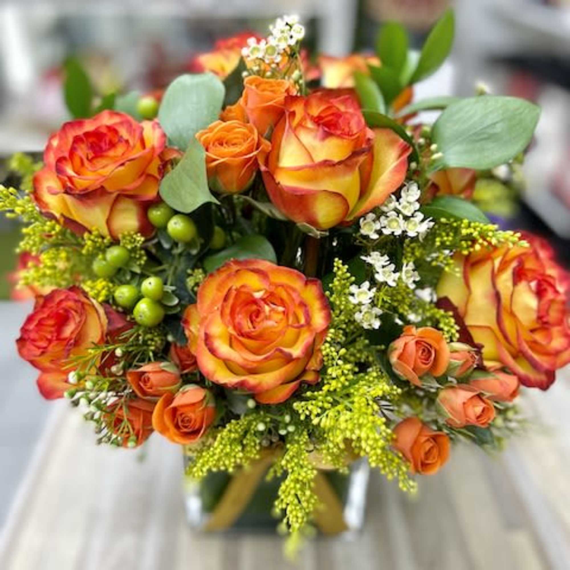 Nice and Cute flower composition of flowers placed in a cube crystal