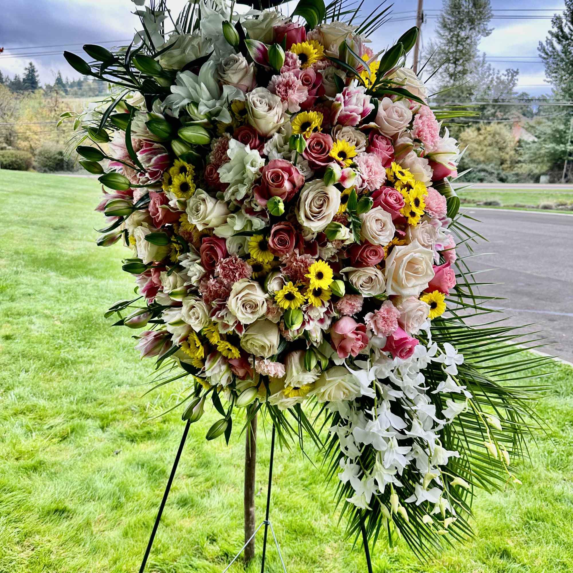 An all white tribute, this funeral spray is pure and tranquil. Featuring