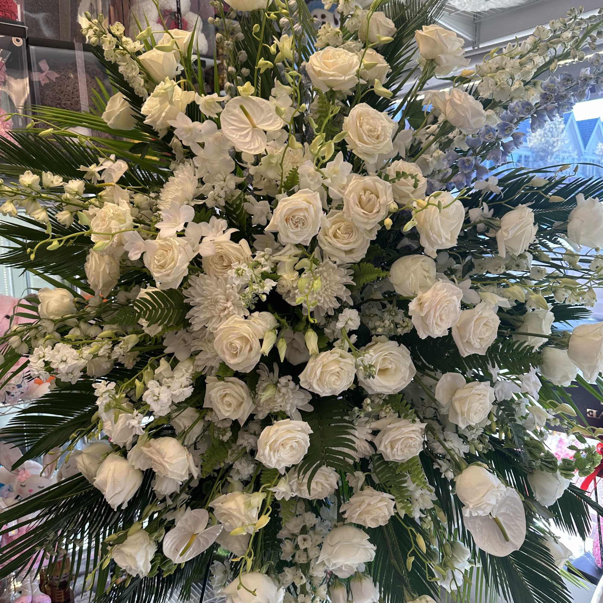 An all white tribute, this funeral spray is pure and tranquil. Featuring