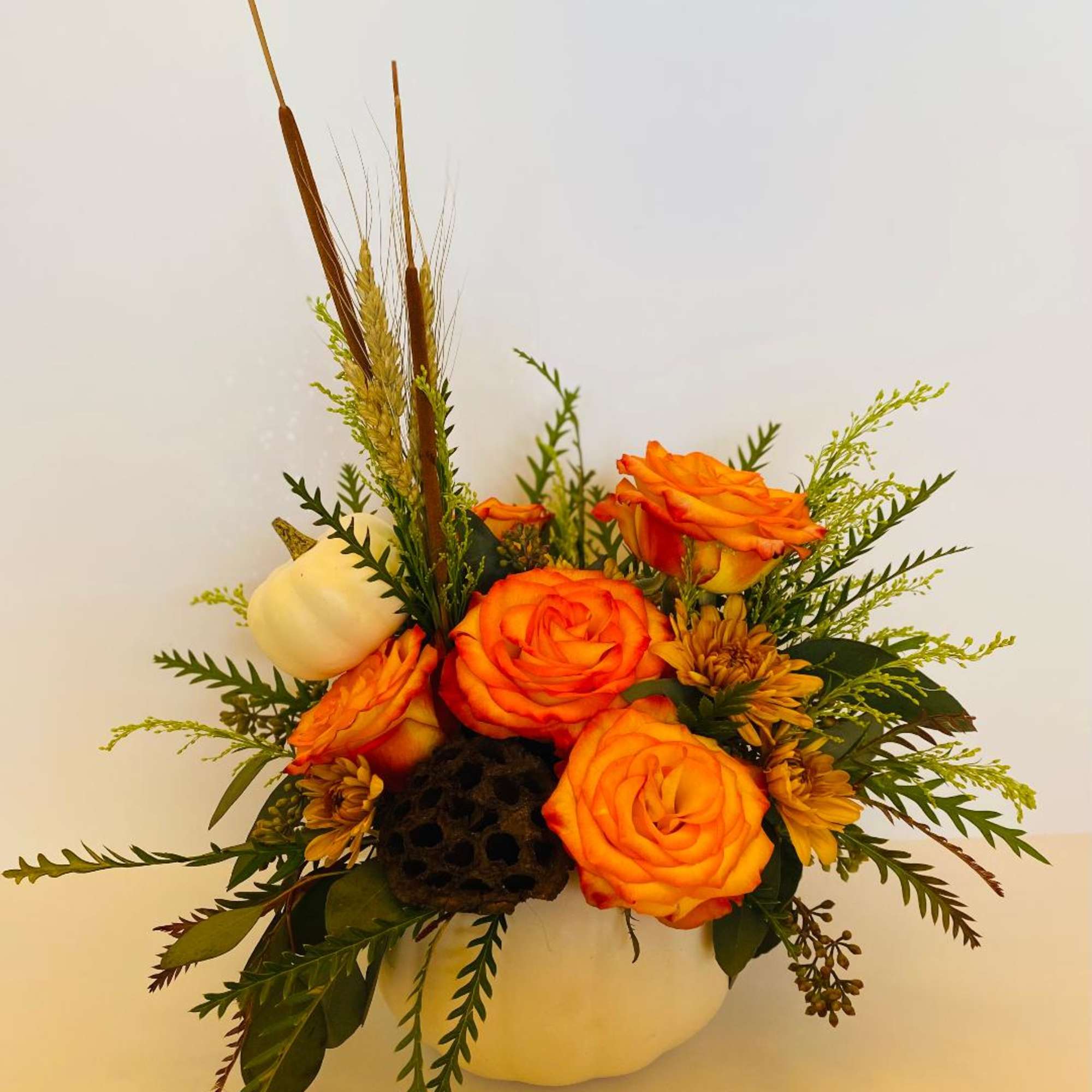 This beautiful seasonal arrangement is perfect for your Thanksgiving table. Composed of This beautiful seasonal arrangement is perfect for your Thanksgiving table. Composed of
