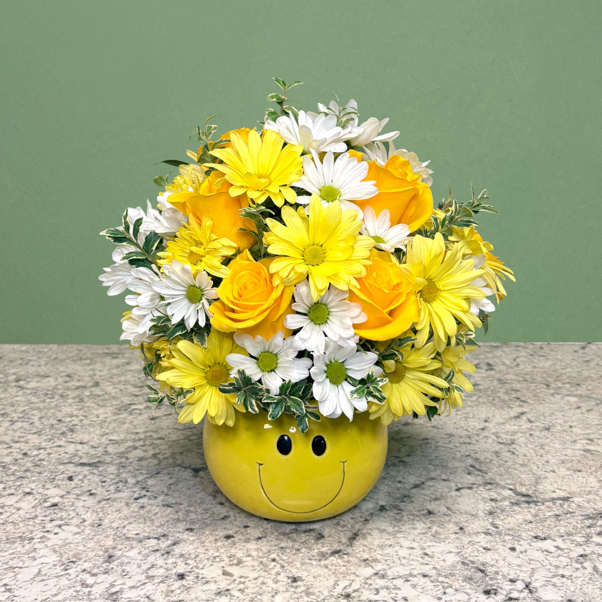 A cheerful arrangement designed to brighten any day, featuring vibrant yellow roses
