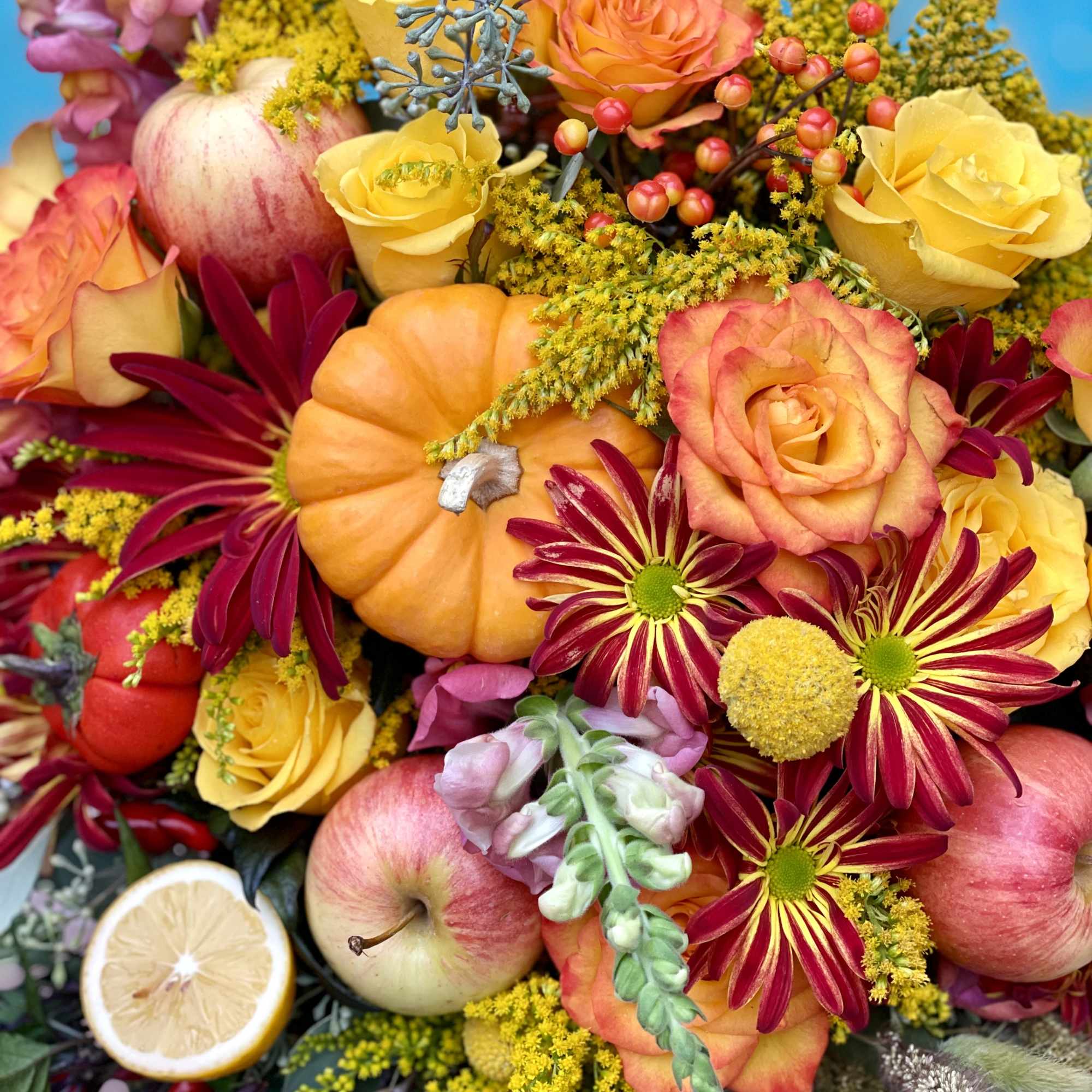 A pumpkin floral design is a charming and creative arrangement that combines