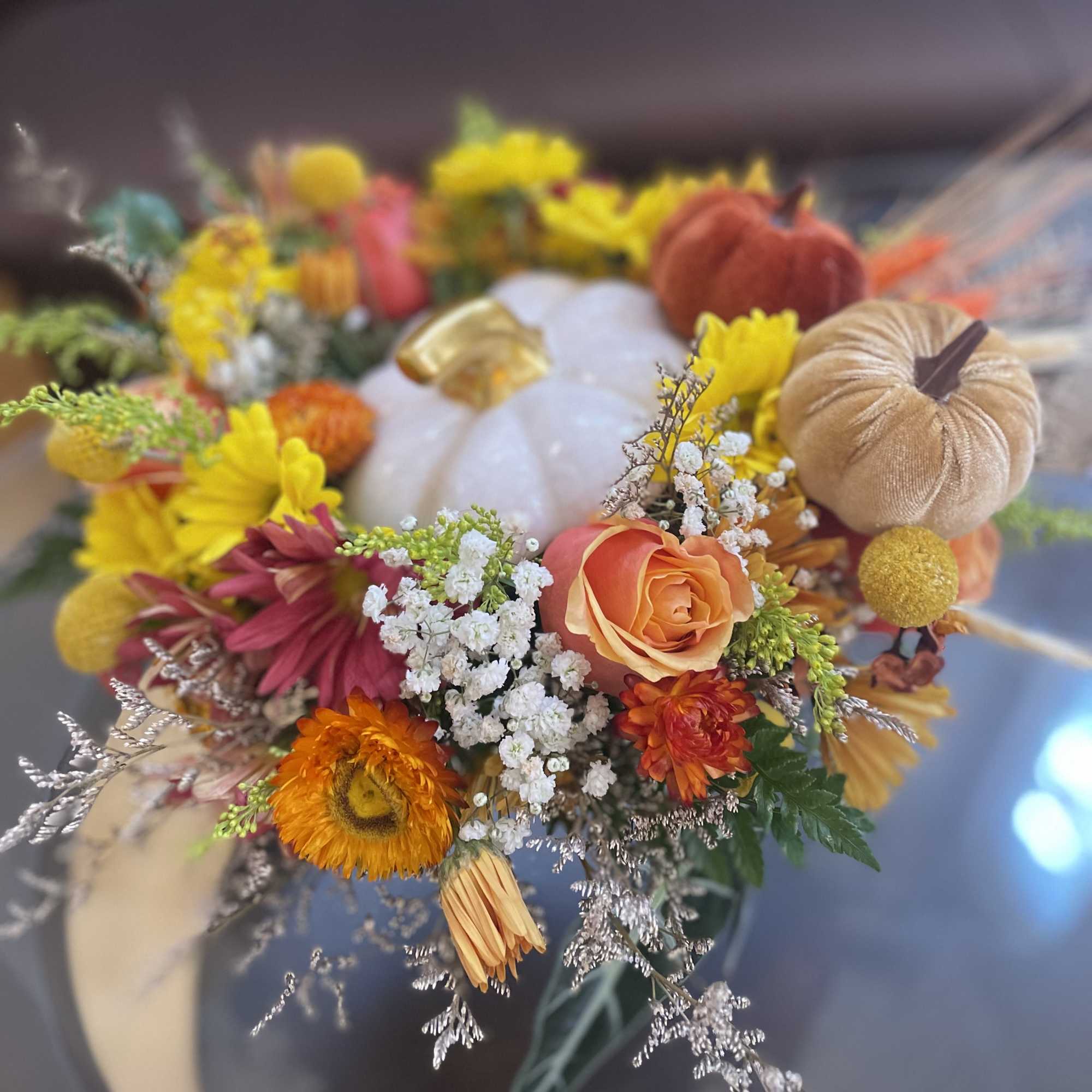 Embrace Fall and check out our vibrant fall arrangement featuring a unique