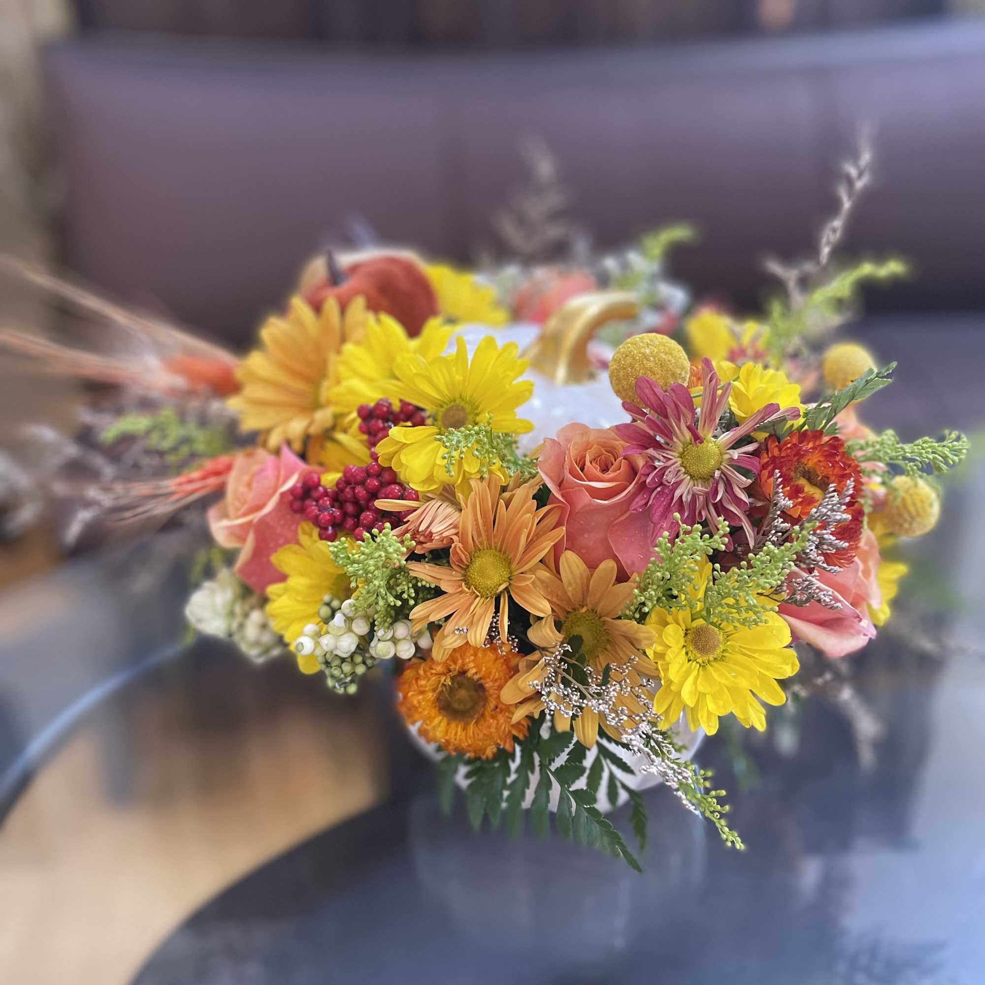 Embrace Fall and check out our vibrant fall arrangement featuring a unique
