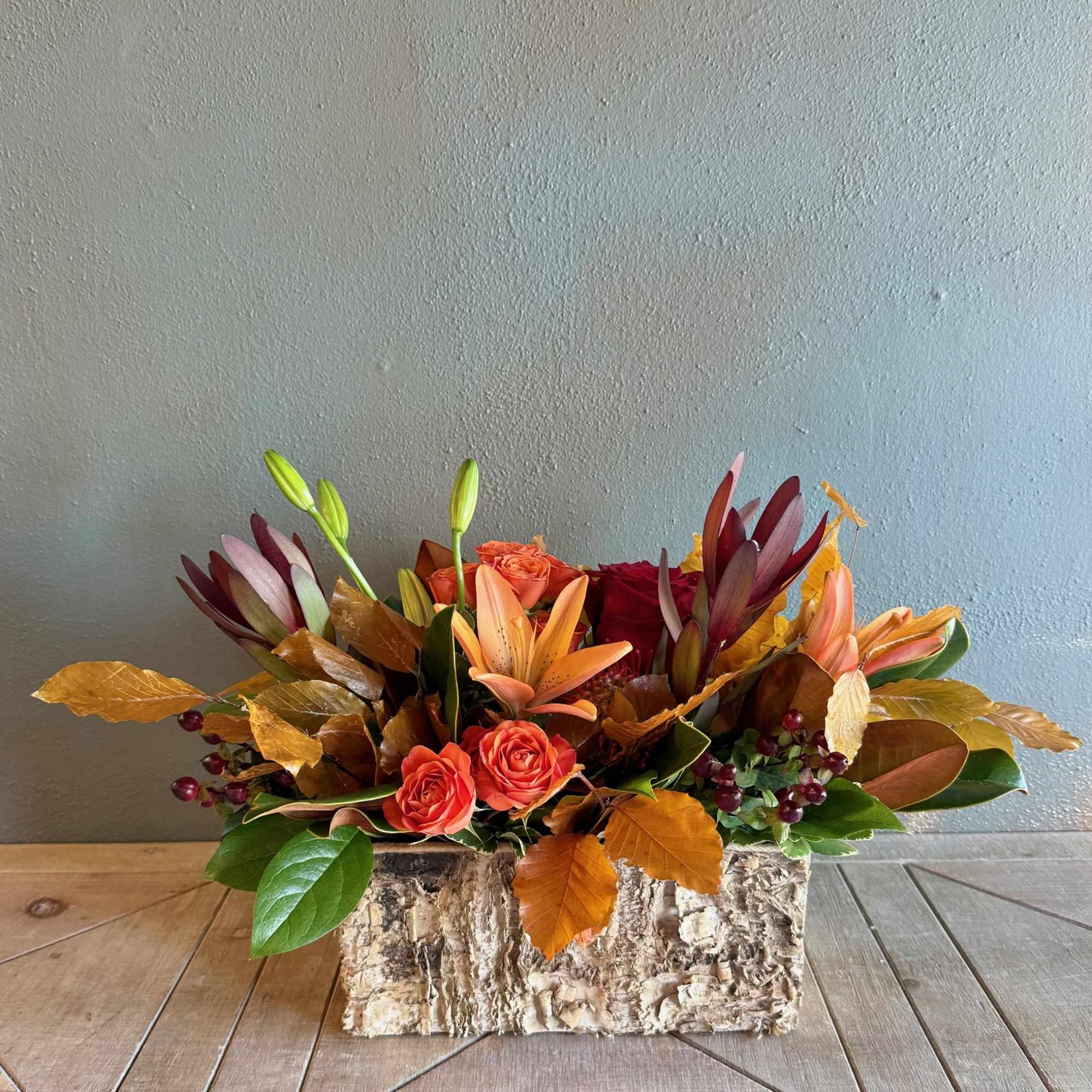 Capturing the essence of a crisp autumn stroll, this beautiful arrangement features