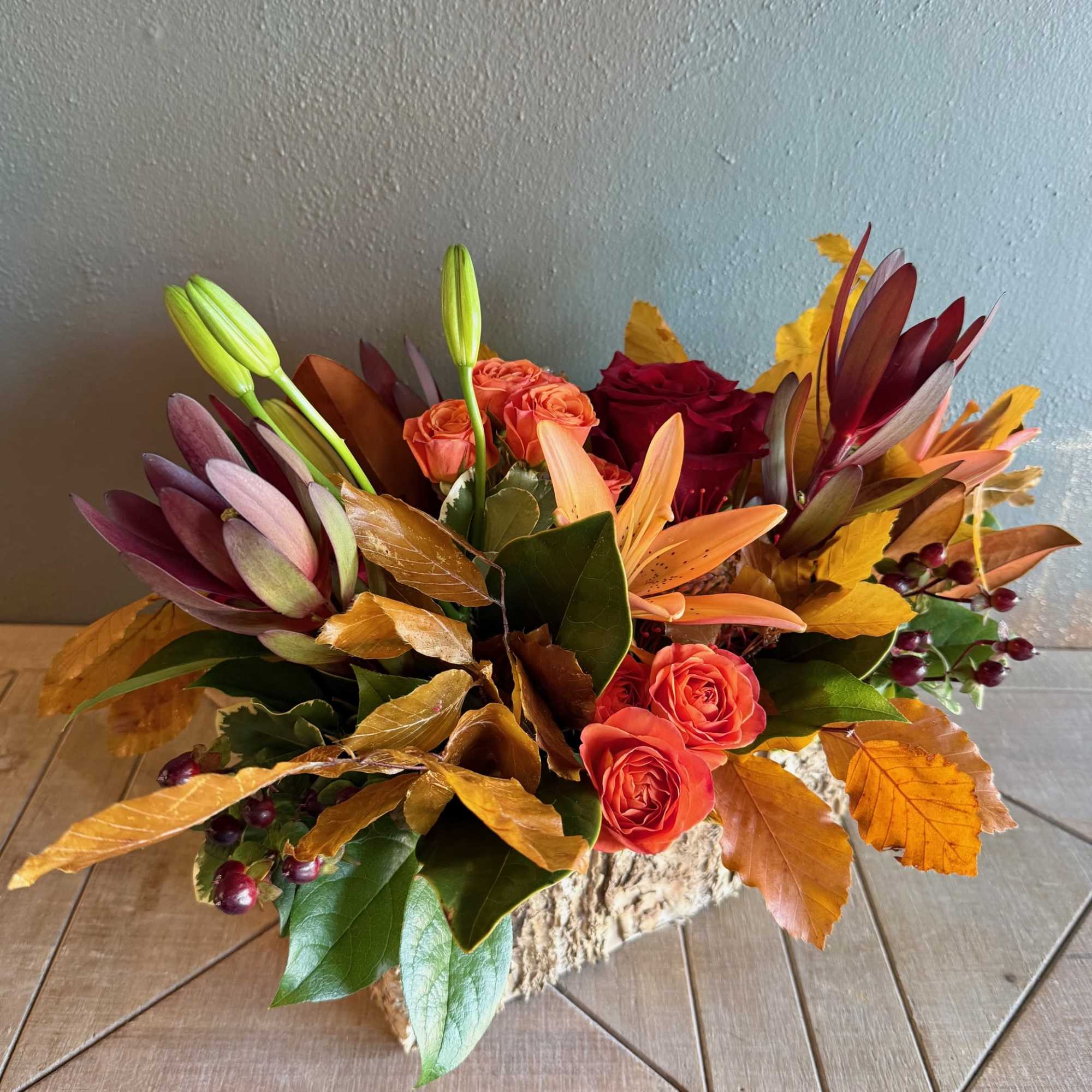 Capturing the essence of a crisp autumn stroll, this beautiful arrangement features