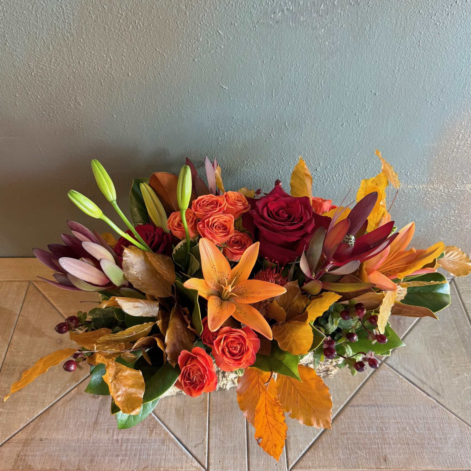 Capturing the essence of a crisp autumn stroll, this beautiful arrangement features
