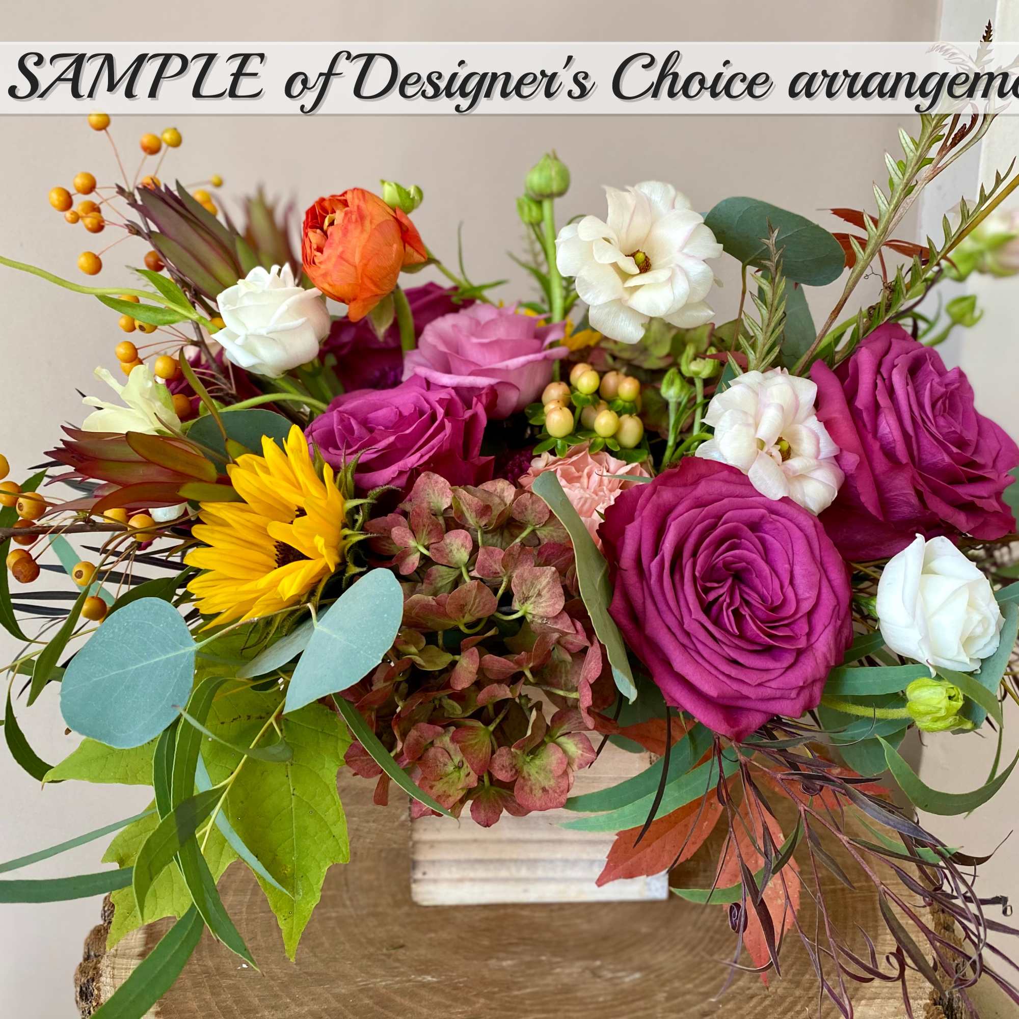 An arrangement of freshest Seasonal Fall Flowers beautifully arranged in a container.