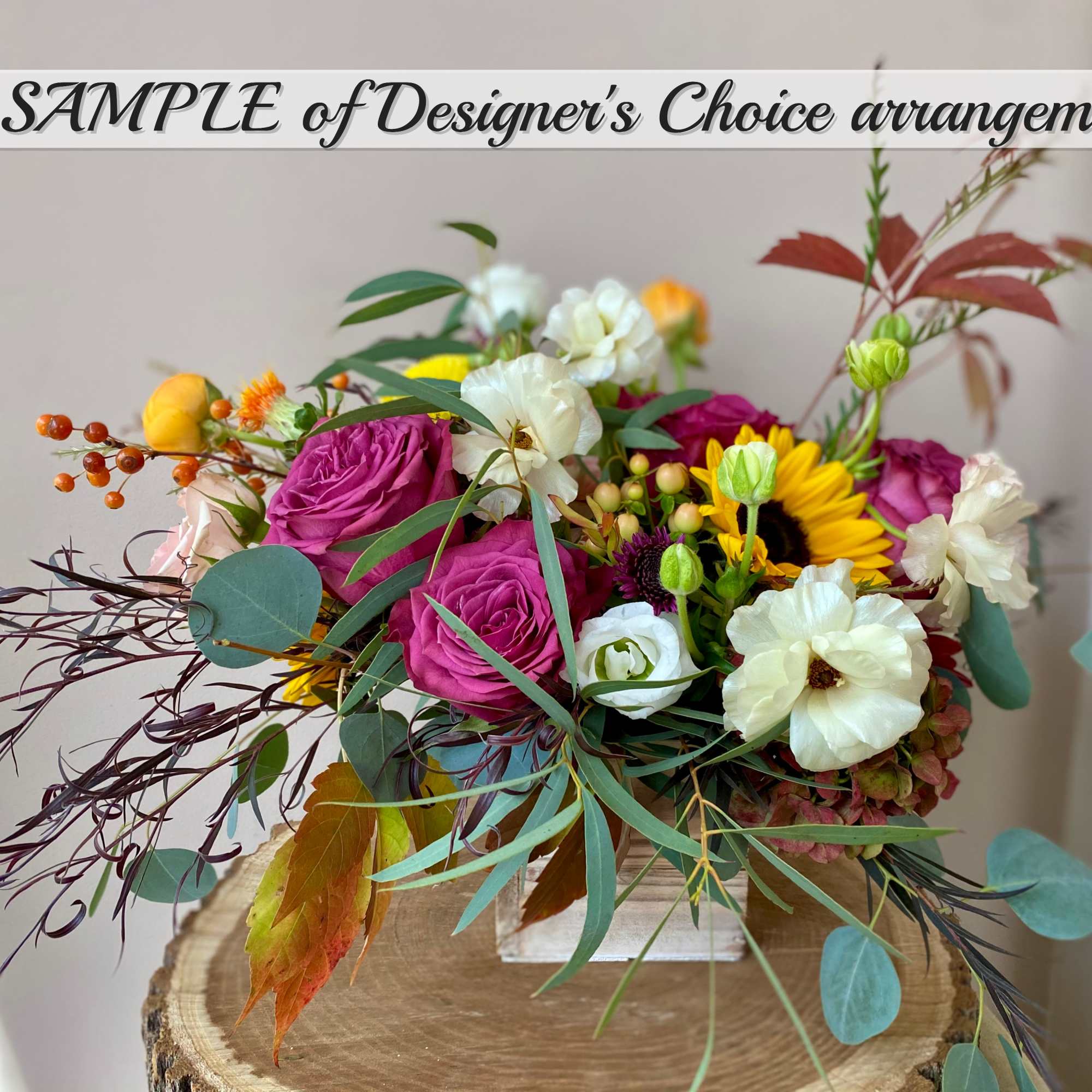 An arrangement of freshest Seasonal Fall Flowers beautifully arranged in a container.