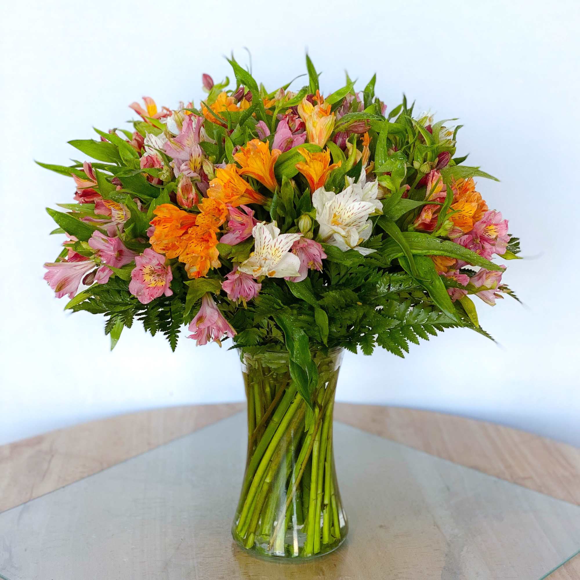 Luscious 30 stem alstroemerias or better known as Peruvian Lilies hand tied