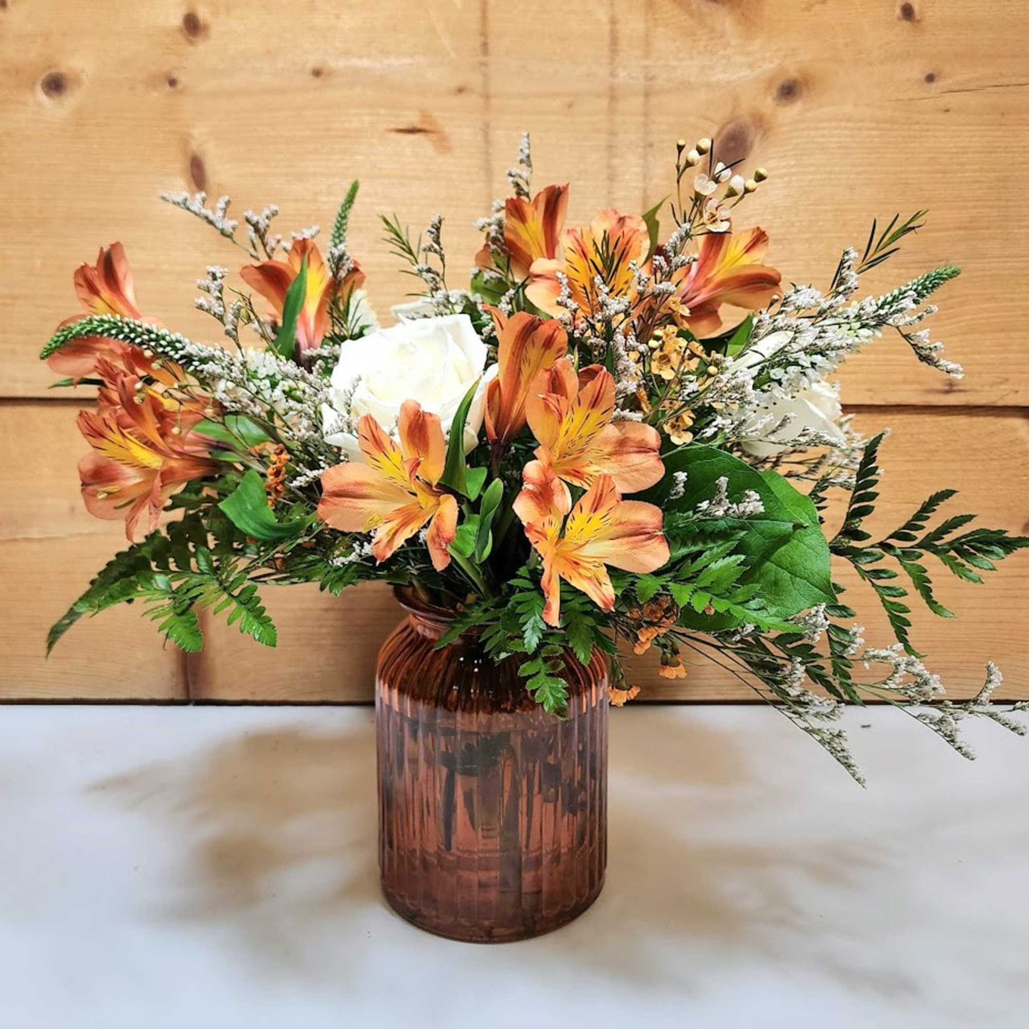 Warm and elegant, the Falling For You bouquet blends rich seasonal hues Warm and elegant, the Falling For You bouquet blends rich seasonal hues