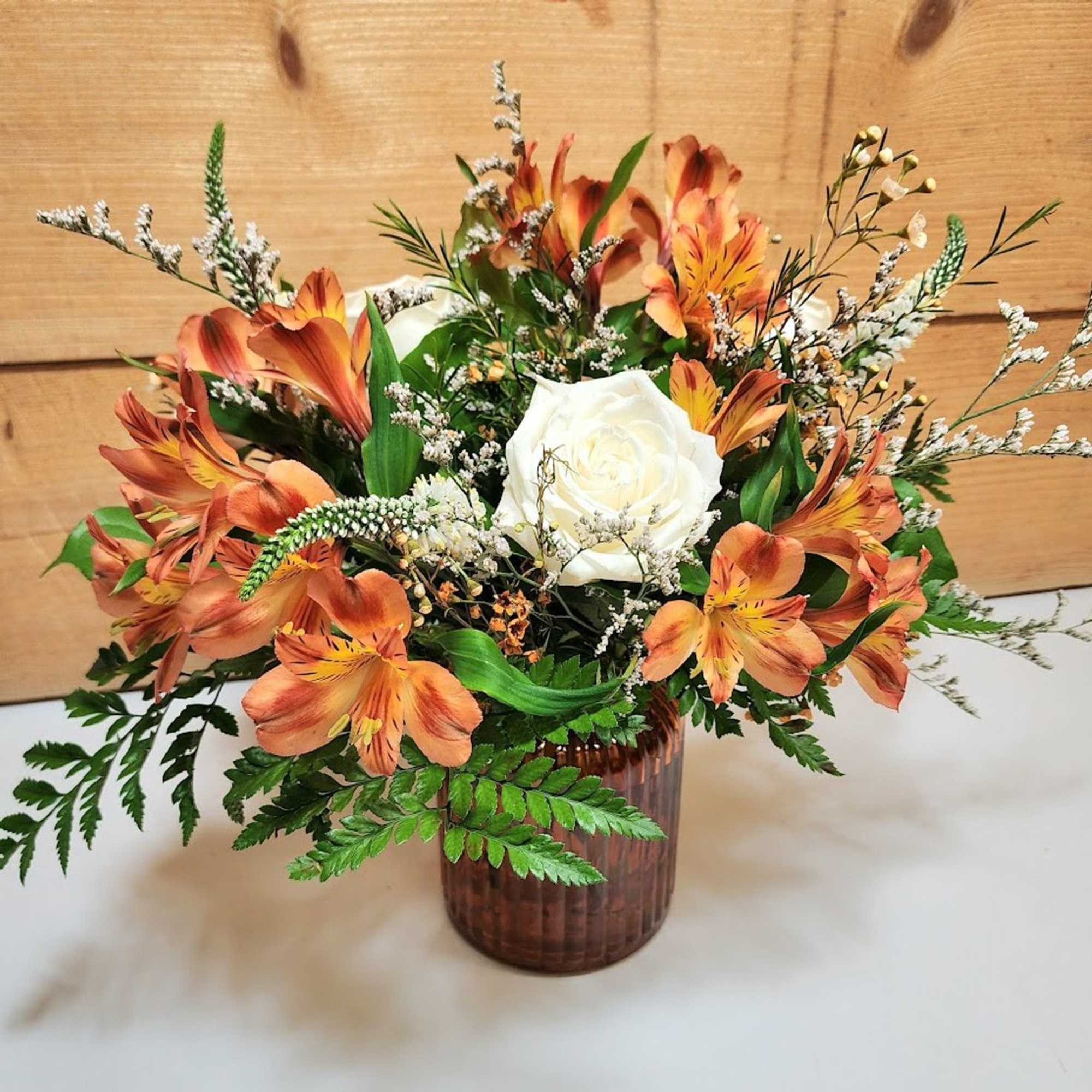 Warm and elegant, the Falling For You bouquet blends rich seasonal hues Warm and elegant, the Falling For You bouquet blends rich seasonal hues