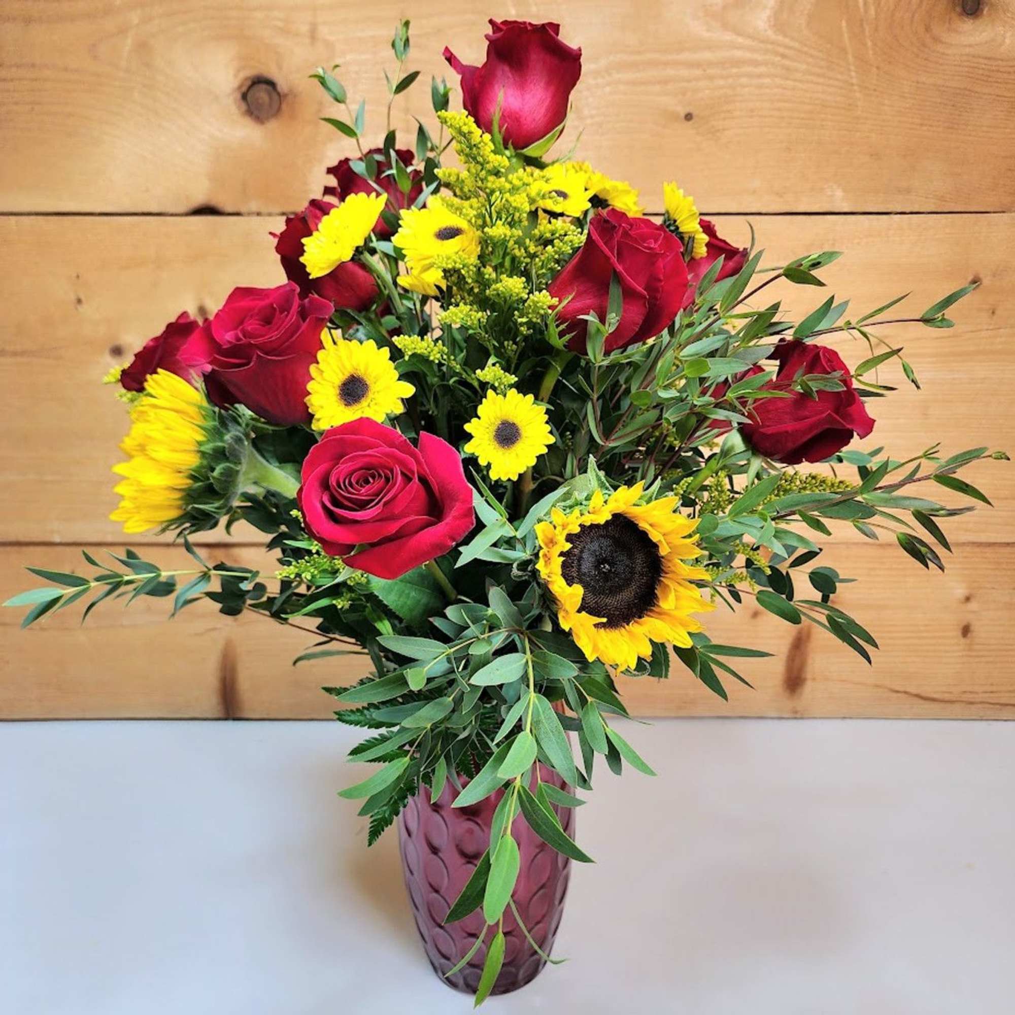 Bright and bold, this bouquet blends the warmth of summer with the Bright and bold, this bouquet blends the warmth of summer with the