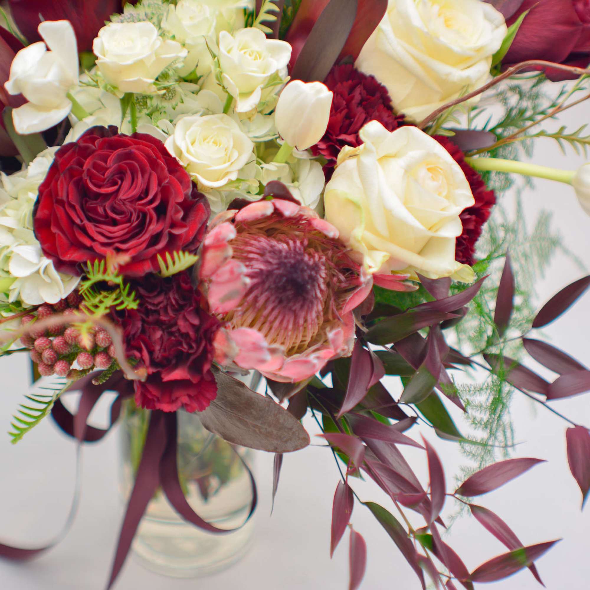 Elegant and unique, this arrangement represents a mysterious fall story, with a