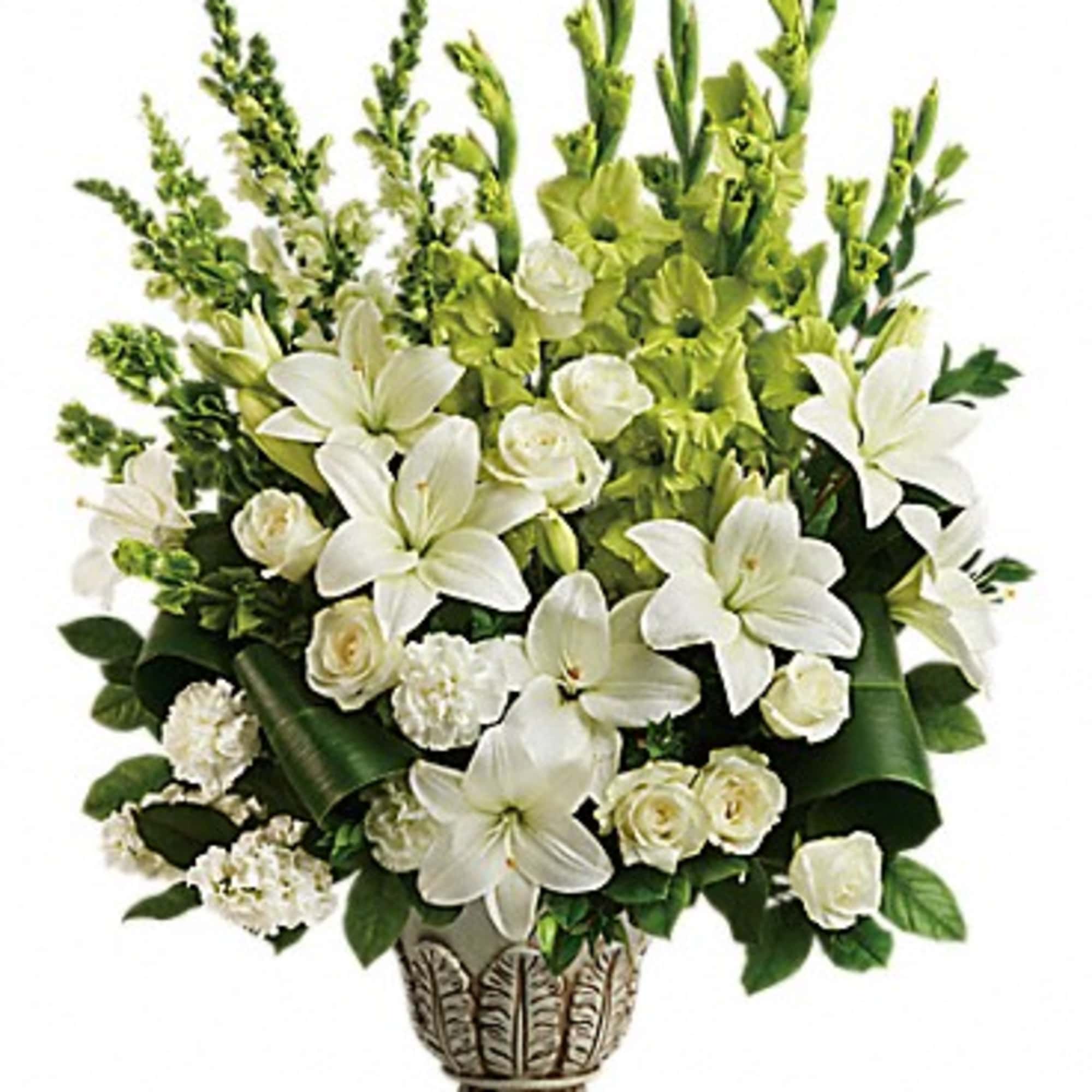 Peaceful and majestic in a large antiqued pot, this wondrous white arrangement