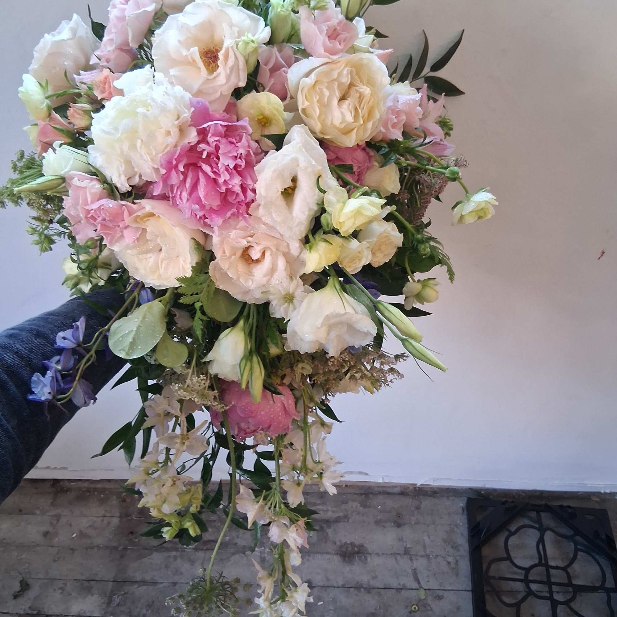 Beautiful vintage bridal cascade with peonies, butterfly ranunculus, roses and other fillers