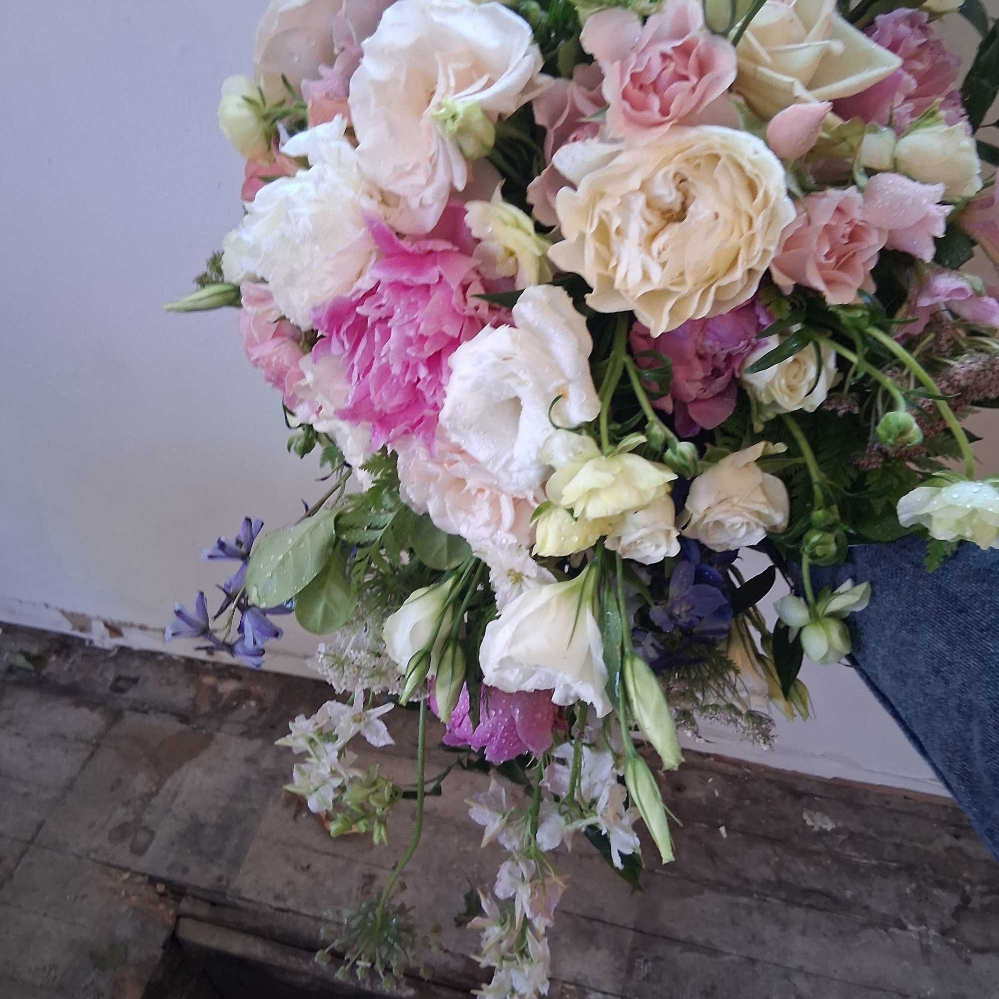 Beautiful vintage bridal cascade with peonies, butterfly ranunculus, roses and other fillers